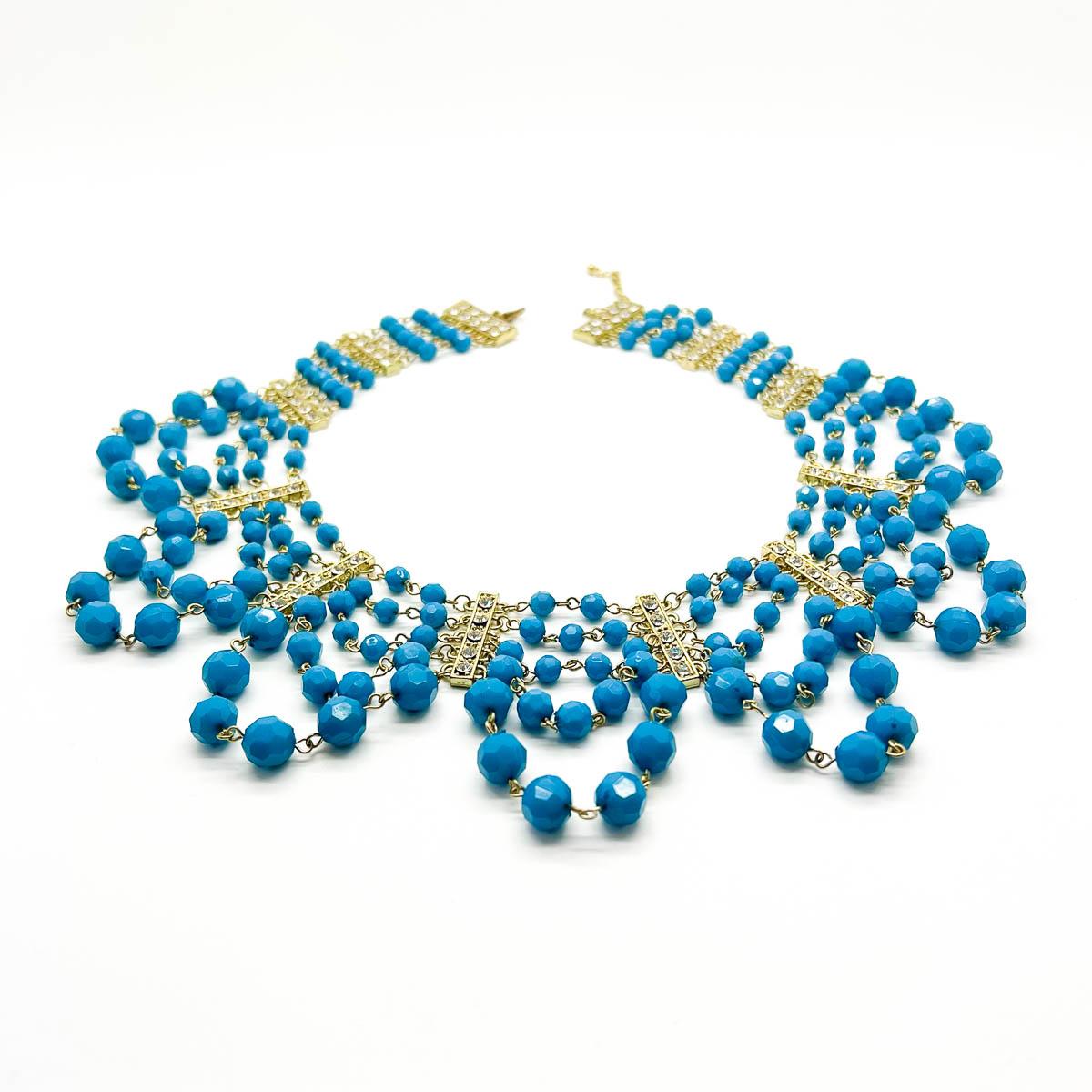 A wonderful Turquoise Crystal Festoon Collar. Featuring rows and rows of beads punctuated with crystal stations. A stunning statement vibe for your look.
An unsigned beauty. A rare treasure. Just because a jewel doesn’t carry a designer name,