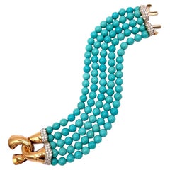 Bracciale in oro con diamanti e perline turchesi