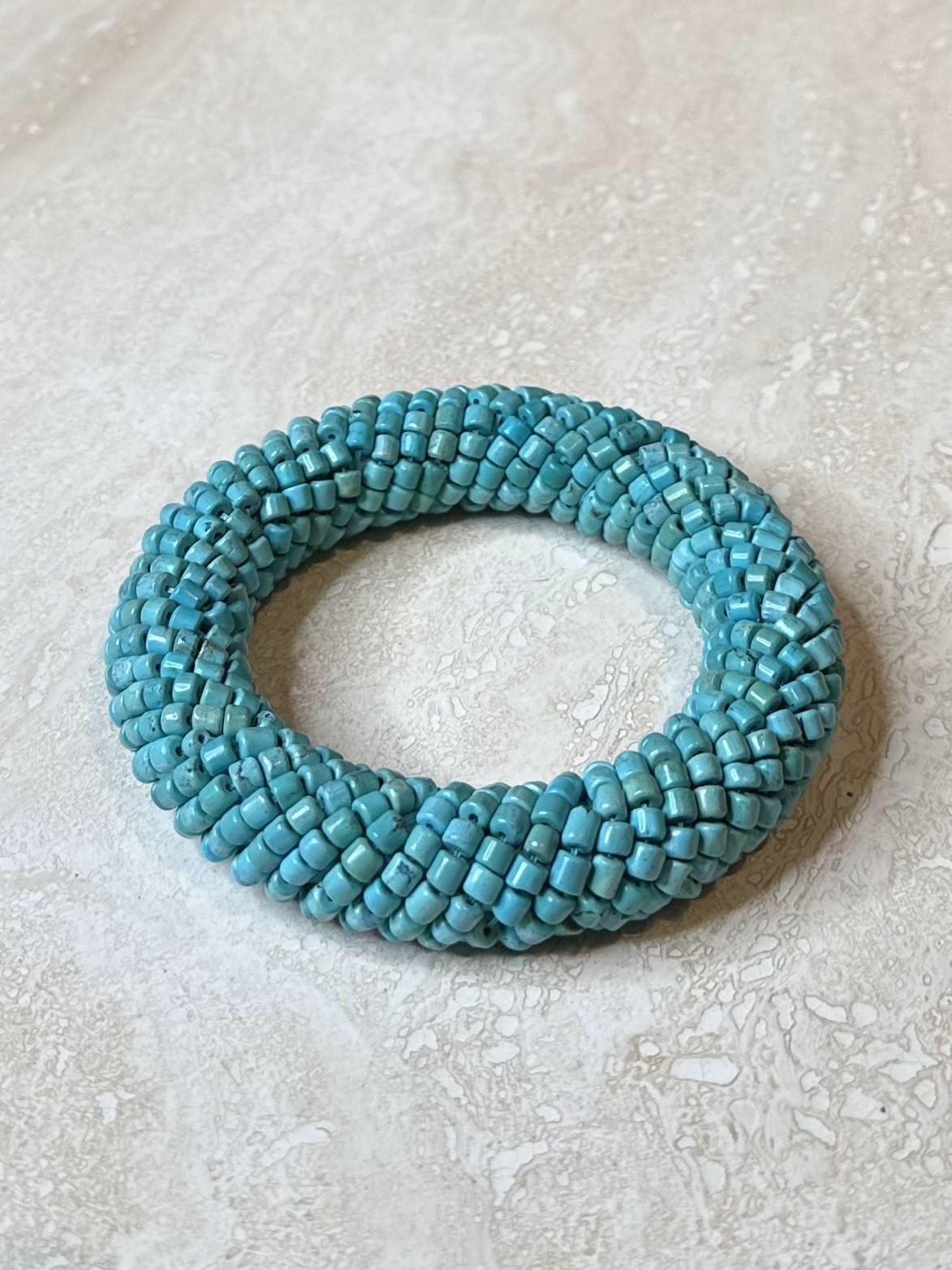 The Turquoise Beaded Bangle is a vibrant and stylish accessory that adds a pop of color and texture to your outfit. With its natural, earthy appeal, it’s perfect for bohemian, beachy, or festival-inspired looks, but it’s versatile enough to be worn