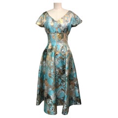 Used Turquoise Black Gold Abstract Floral Taffeta Fit and Flare Dress Piped in Gold 