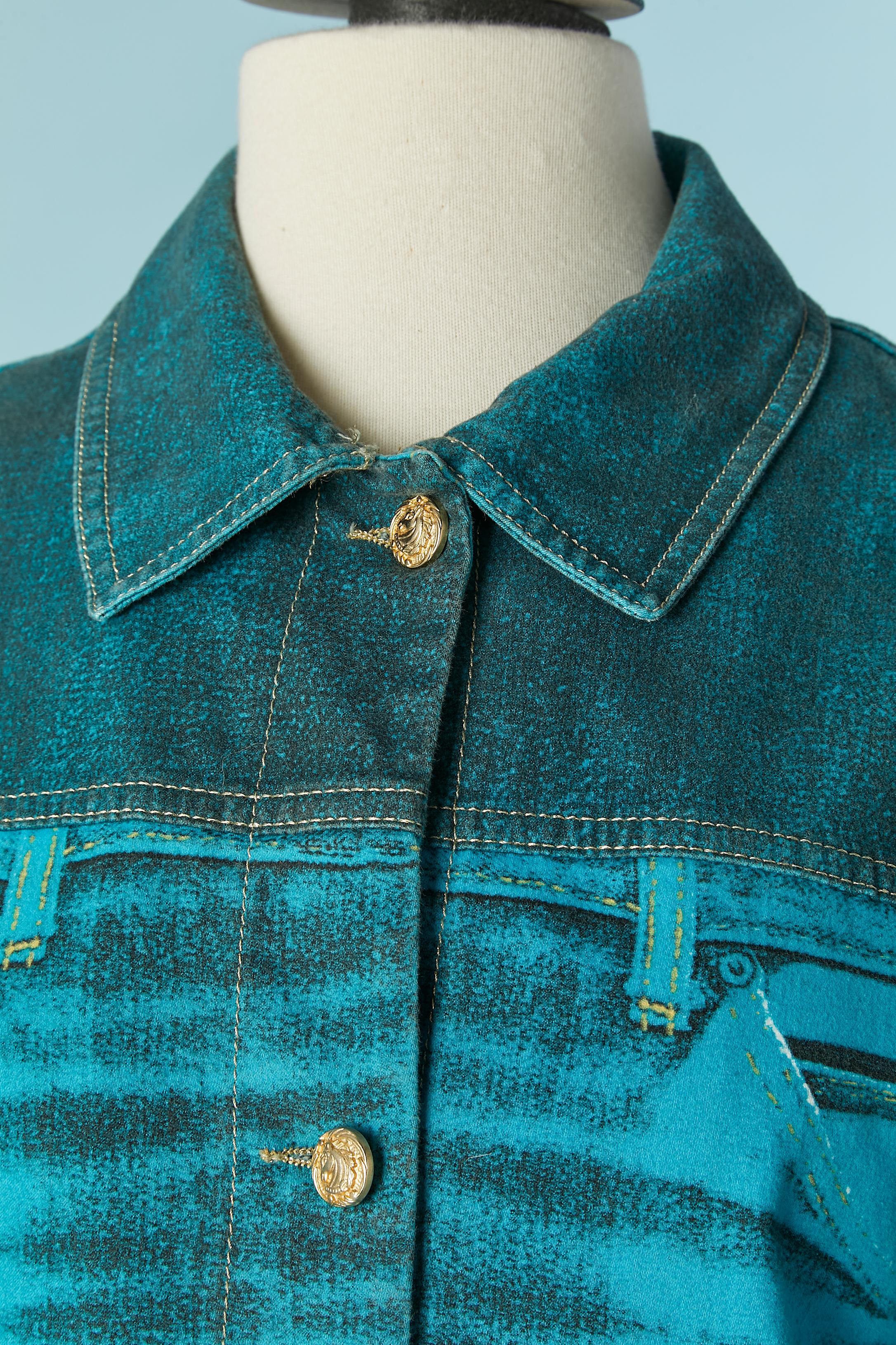 Turquoise blue denim coat with branded button and buttonhole closure on the middle front. Snap closure on the cuffs. Gold thread top-stitching. 
SIZE S but fit also M 