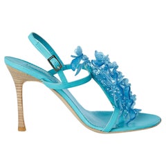 Sandalias de piel azul turquesa con adorno de flores Cesare Piaciotti