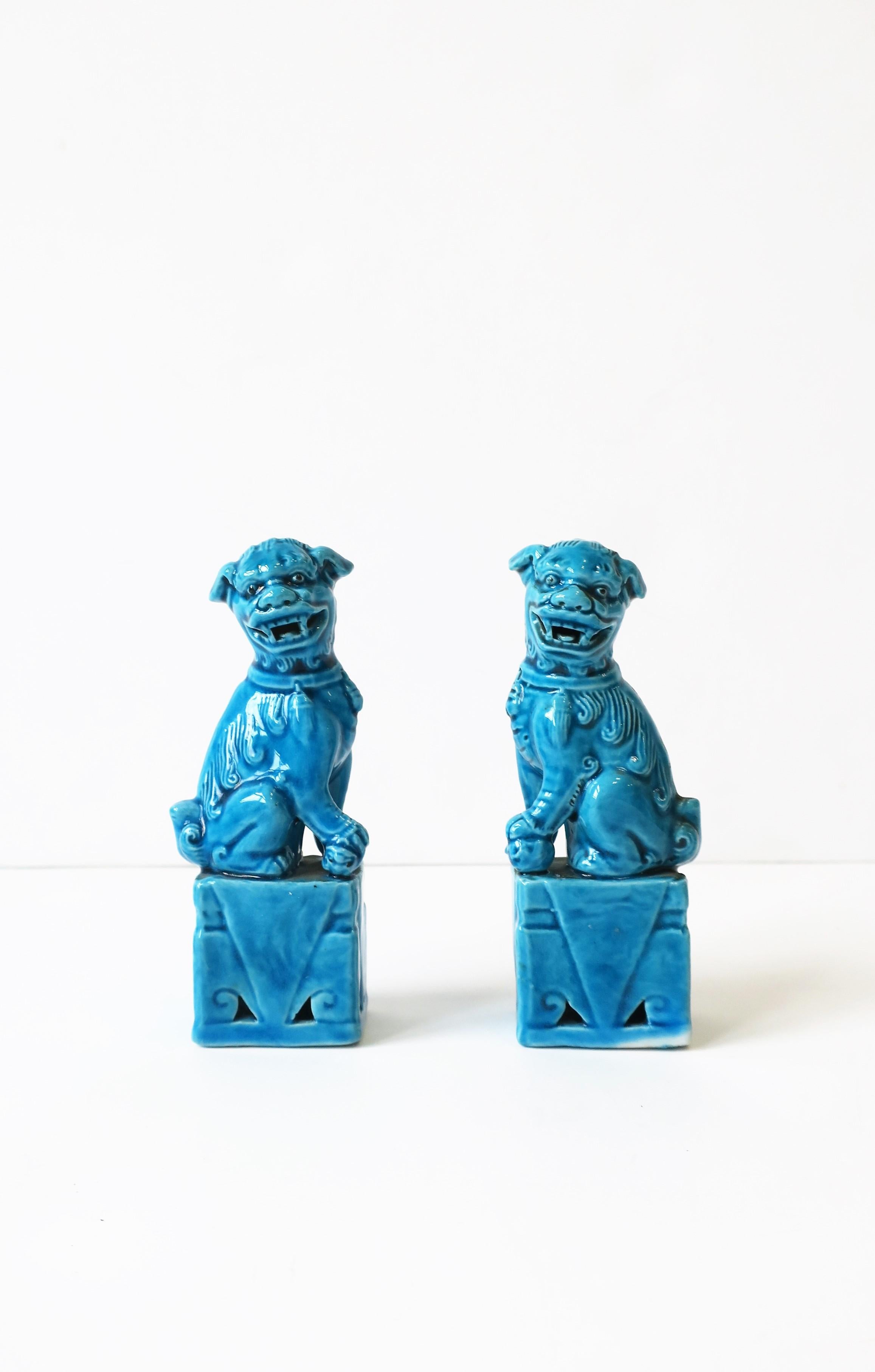 A beautiful small pair of ceramic turquoise blue lion foo dogs. 
Measurement: 4.25