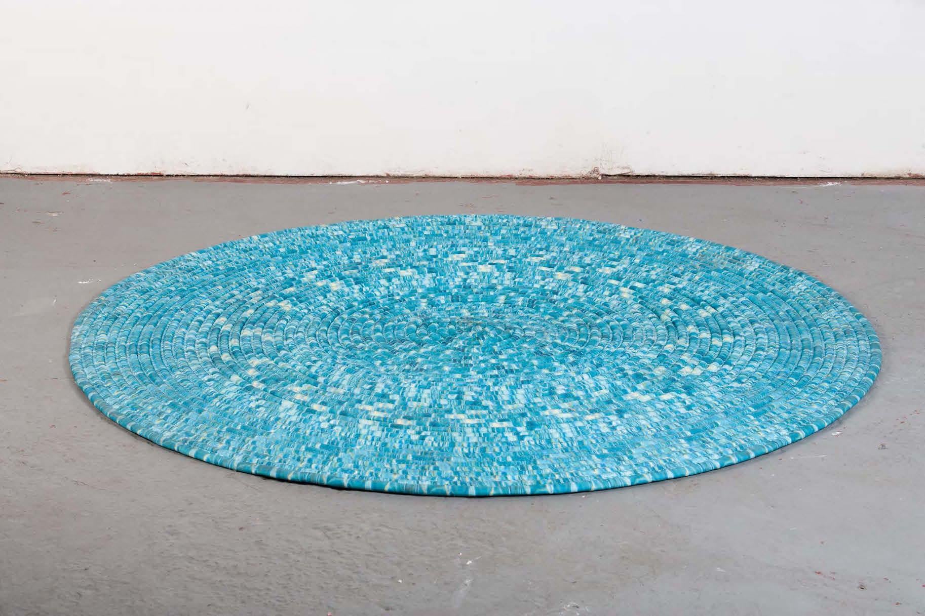 Turquoise blue rug in pieced, stuffed, and coiled cotton. Designed by Katie Stout, USA.
 
