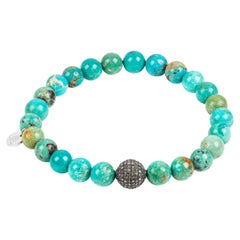 Turquoise bracelet with black rhodium plated diamond-encrusted bead for Men
