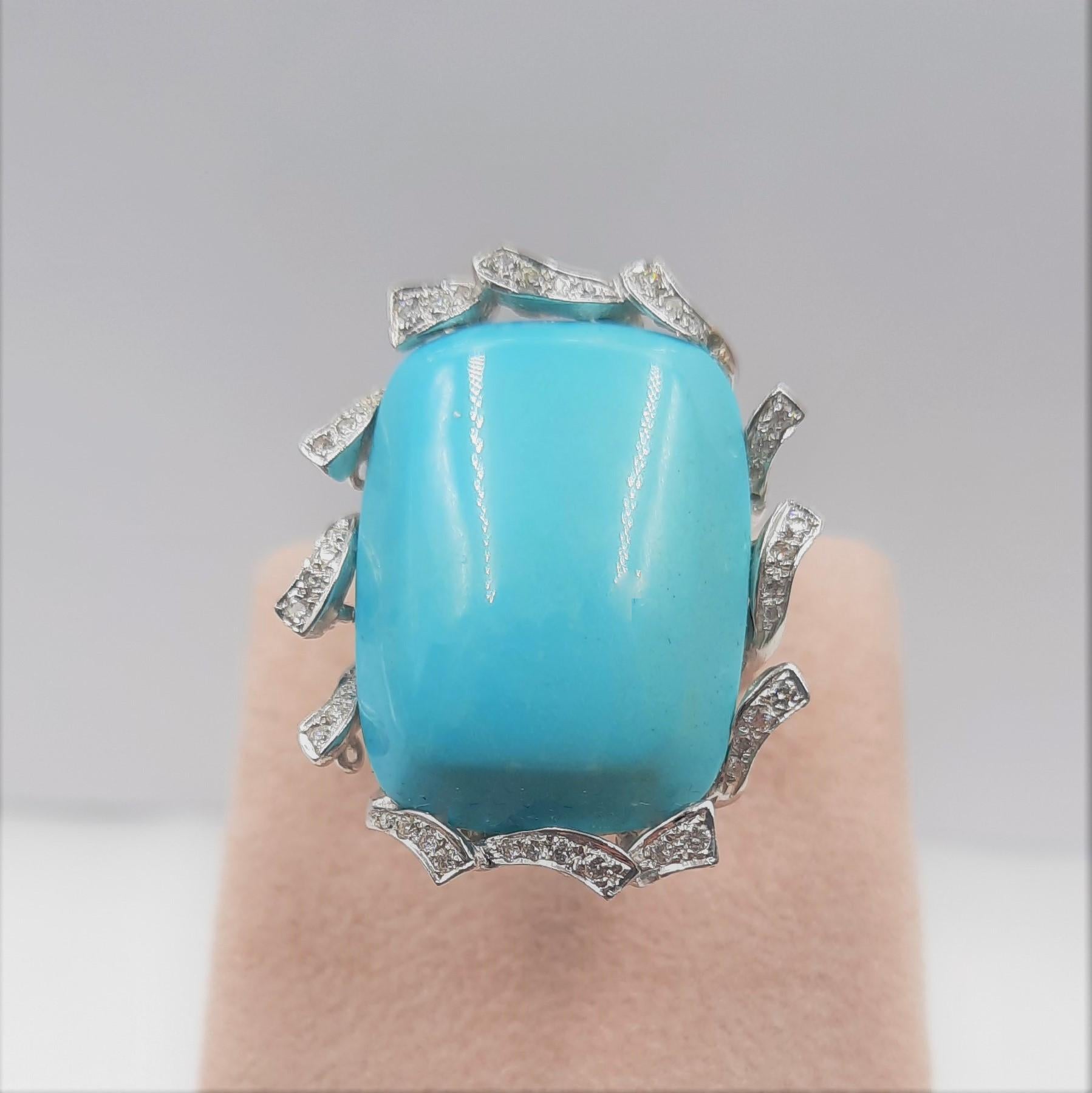 Elegant turquoise  (4.5 grams), Brilliant cut diamond (0.3 carats) and 18 carats white gold (13.4 grams) cocktail ring.