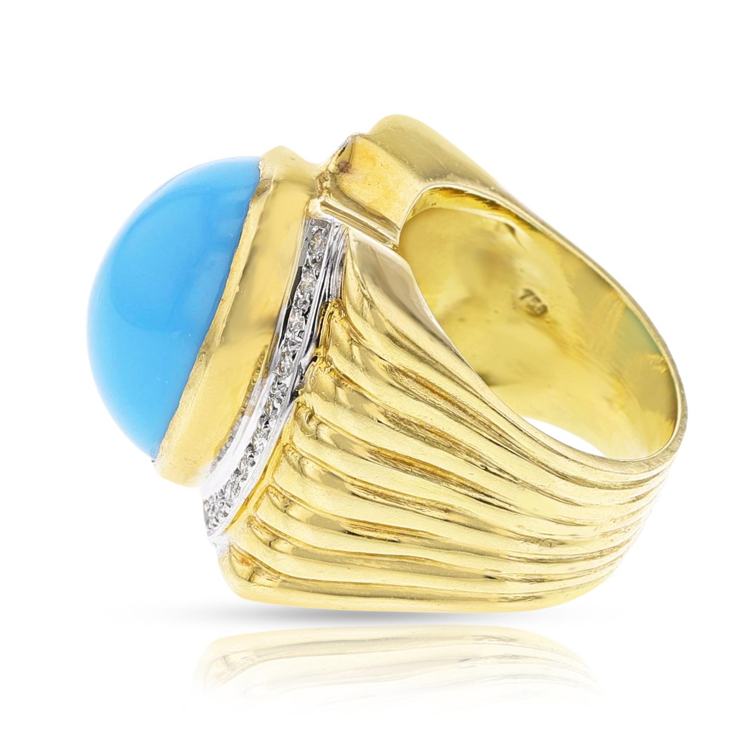 A Turquoise Cabochon and Diamond Cocktail Ring made in 18k yellow gold. The dimensions for the turquoise cabochon is  19 x 14 MM turquoise cabochon. The total weight of the ring is 20.94 grams. The ring size is US 7.75. The diamond weight is appx.