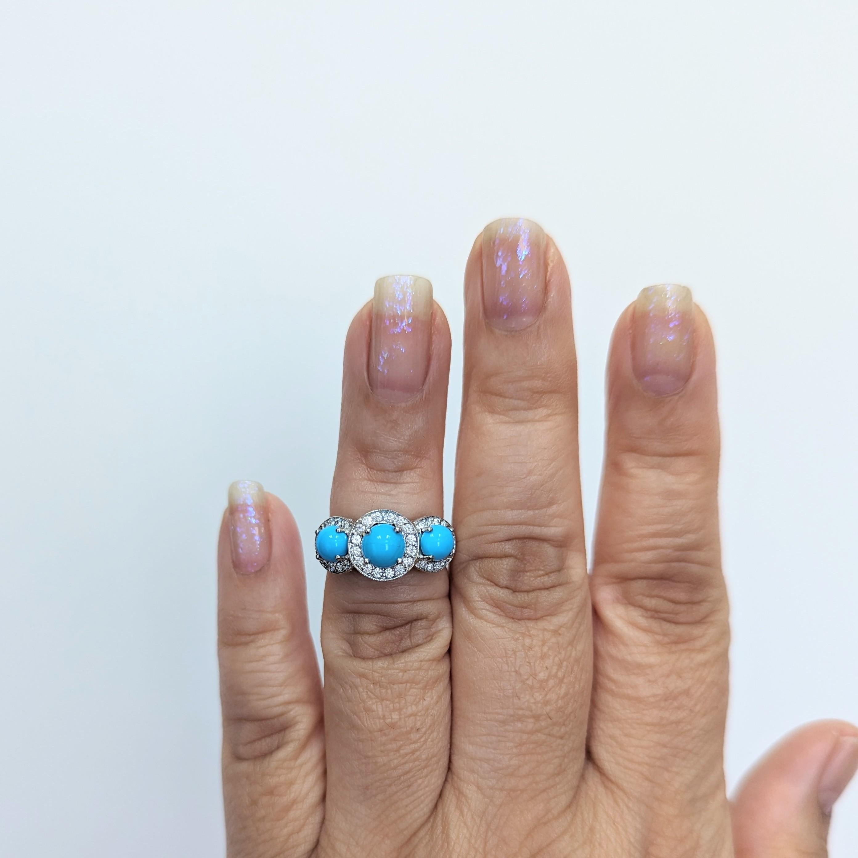Beautiful turquoise round cabochon and white diamond three stone ring.  Handmade in platinum.  Ring size 5.75.