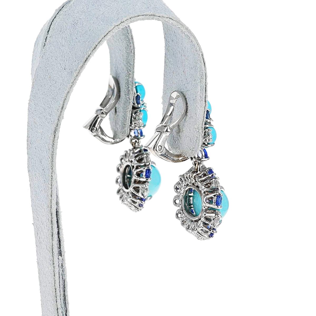 A Turquoise Cabochon, Sapphire and Diamond Dangling Earrings, 18k. The total weight of the earrings is 14.24 grams. Length is 1.30