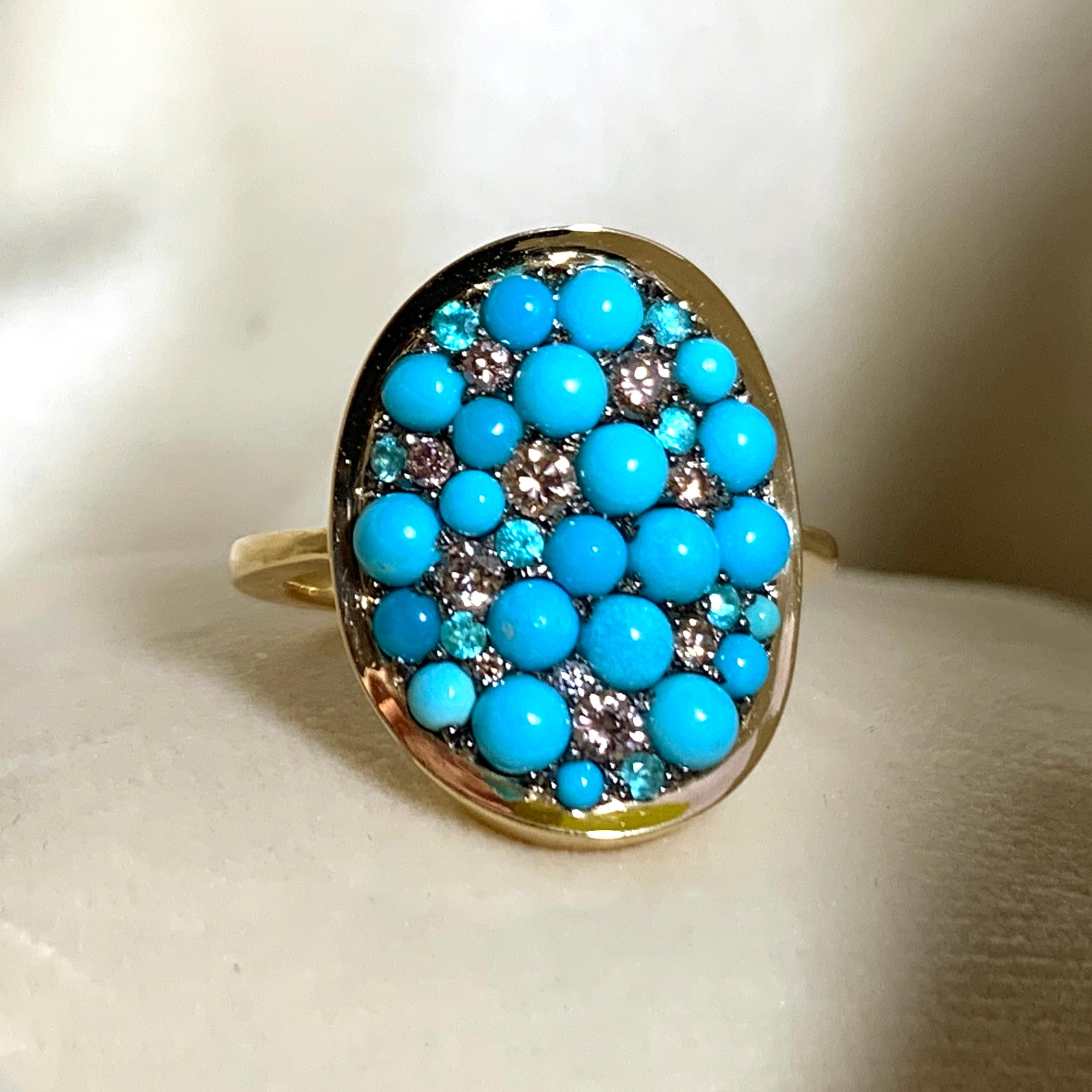 One of a kind ring handmade in Belgium by jewellery artist Joke Quick, in 18K yellow gold 5,8 g & blackened sterling silver 2,5 g (The stones are set on silver to create a black background for the stones. The ring is pave set with:
22 x Turquoise