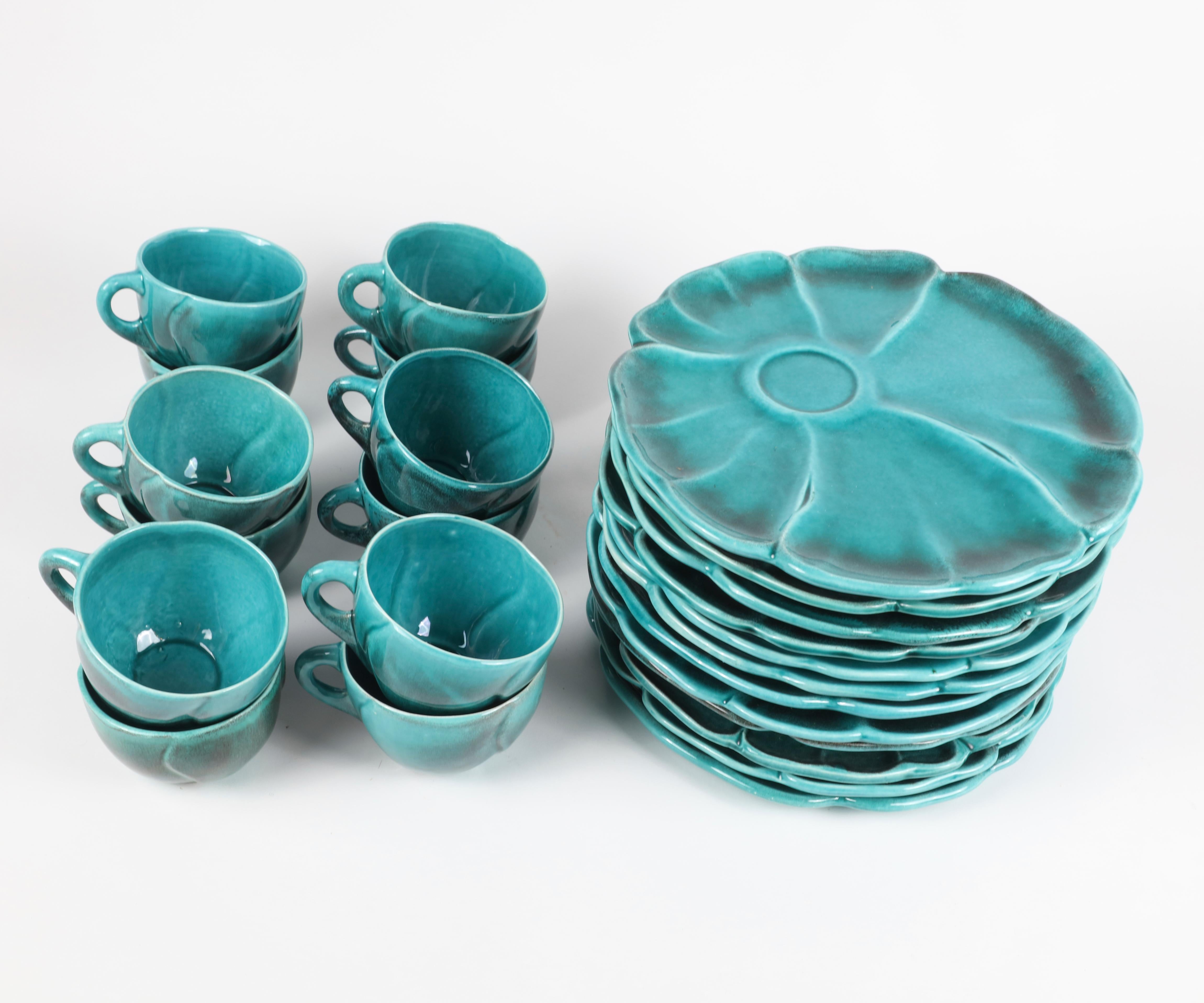 Turquoise ceramic Luncheon set for 12 cups and plates

Plates 10