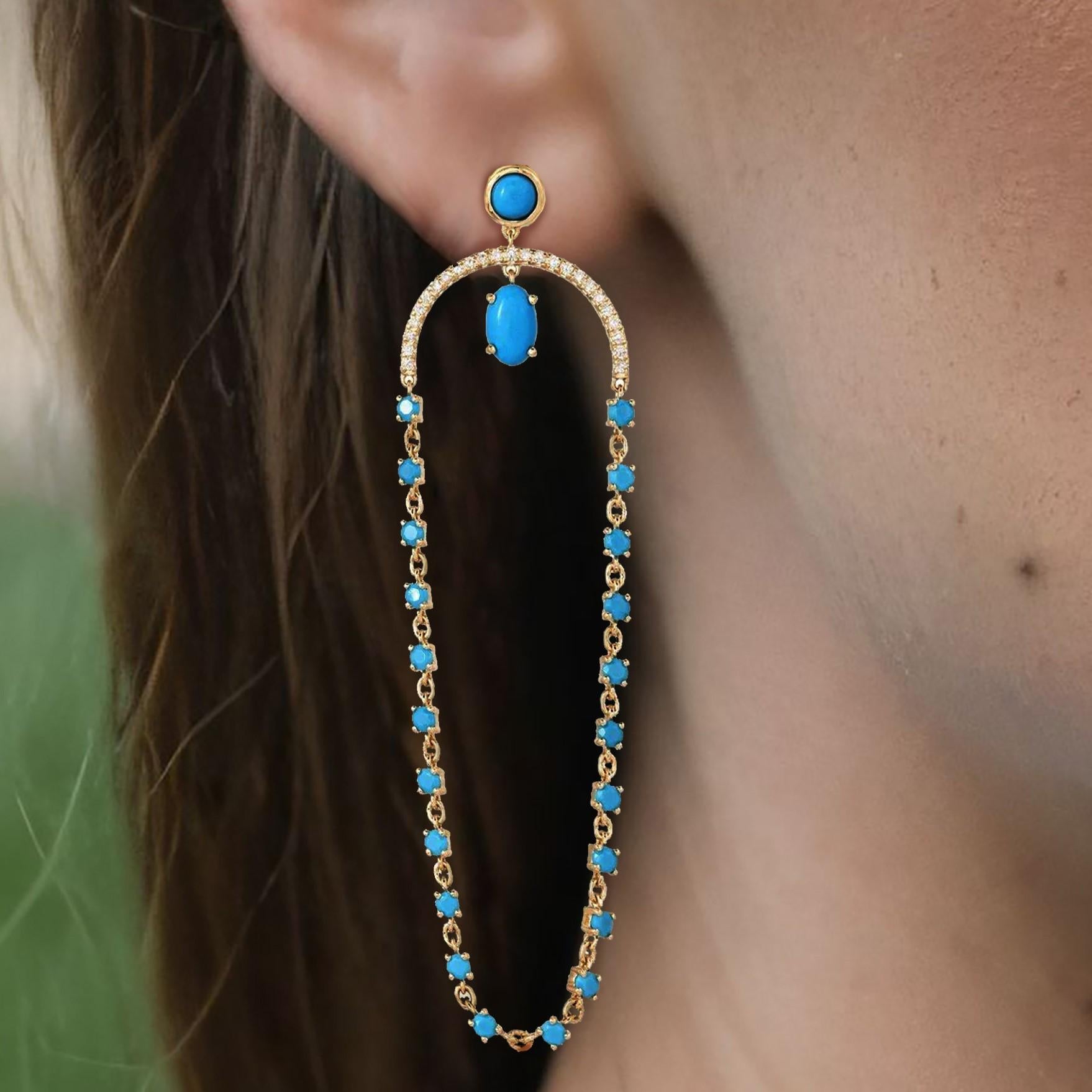 Elevate your style with the Turquoise Chain 14K Yellow Gold Drop Earrings. Crafted in 14K yellow gold, these earrings feature 0.25ct of dazzling natural diamonds and 2.60ct of vibrant turquoise. Weighing 6.25g, they offer a harmonious blend of