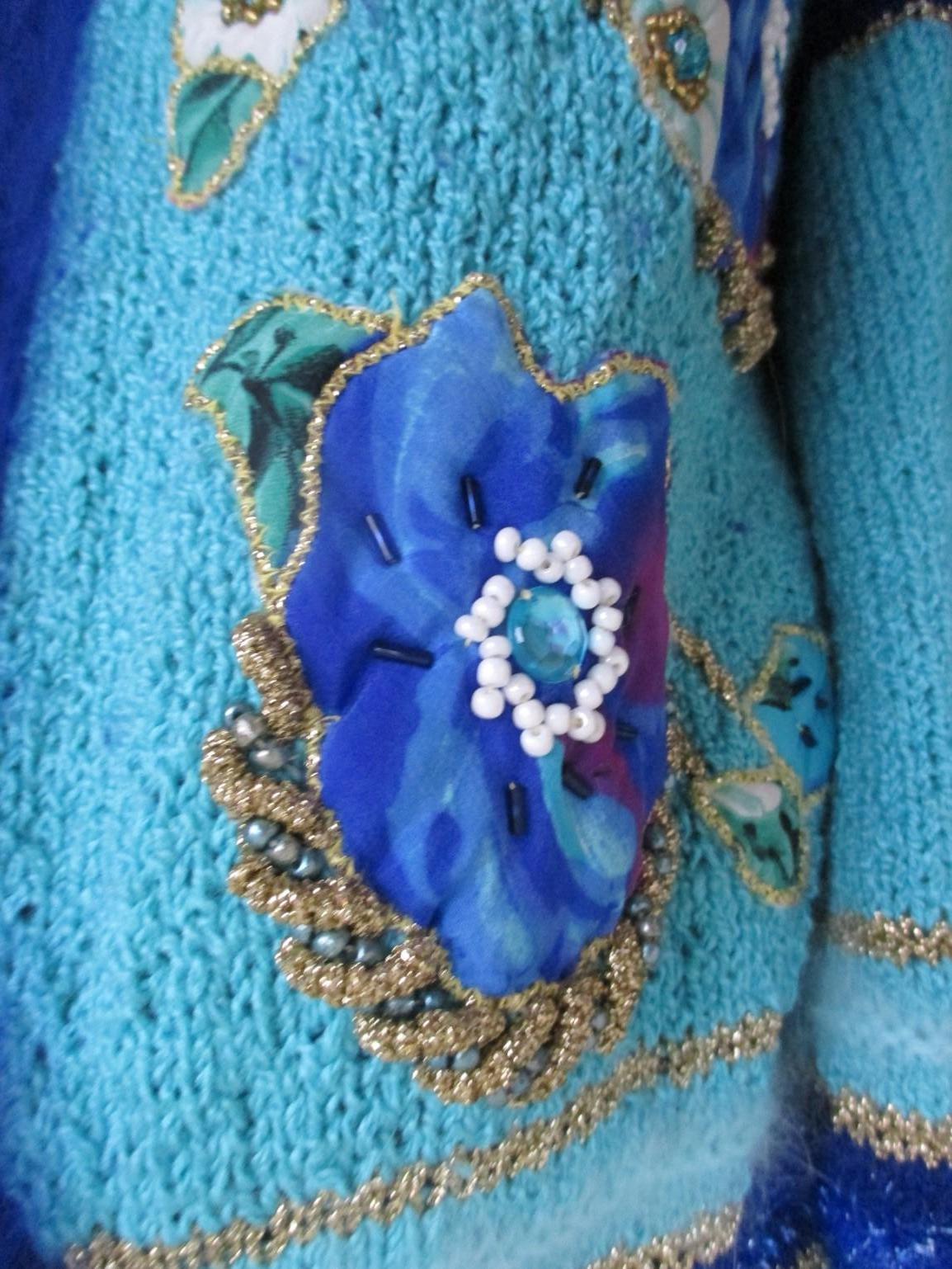 Turquoise coat with flower appliqués 1