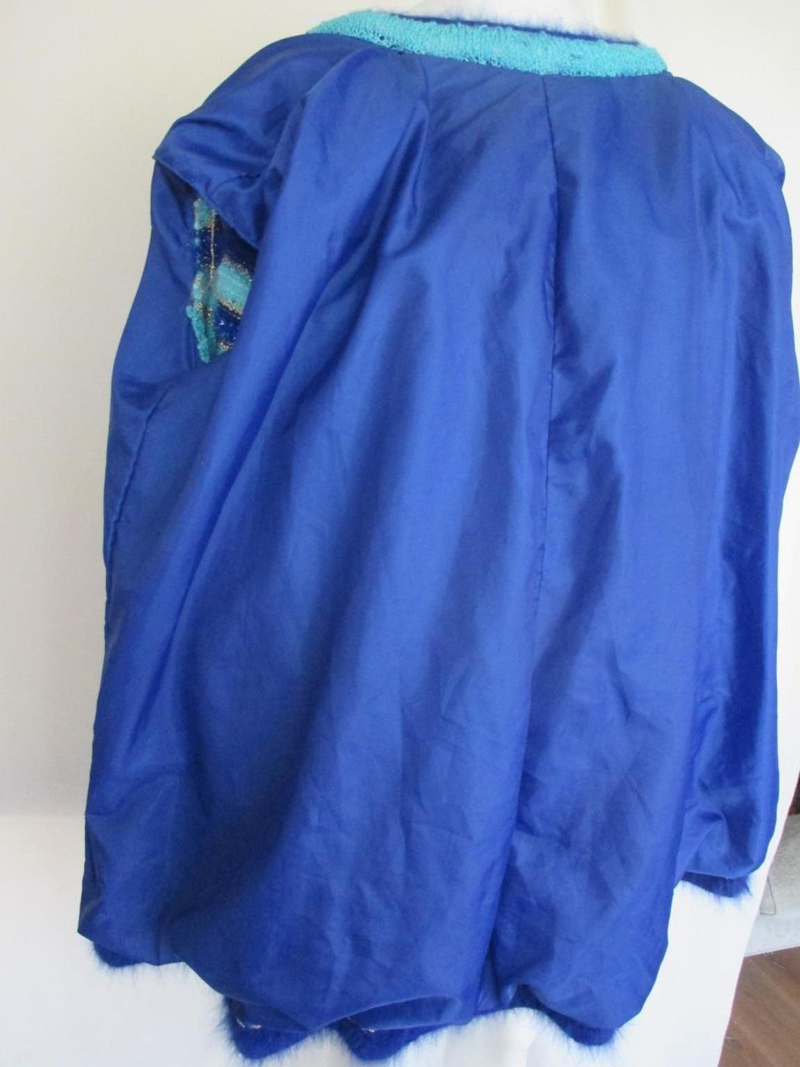 Turquoise coat with flower appliqués 3