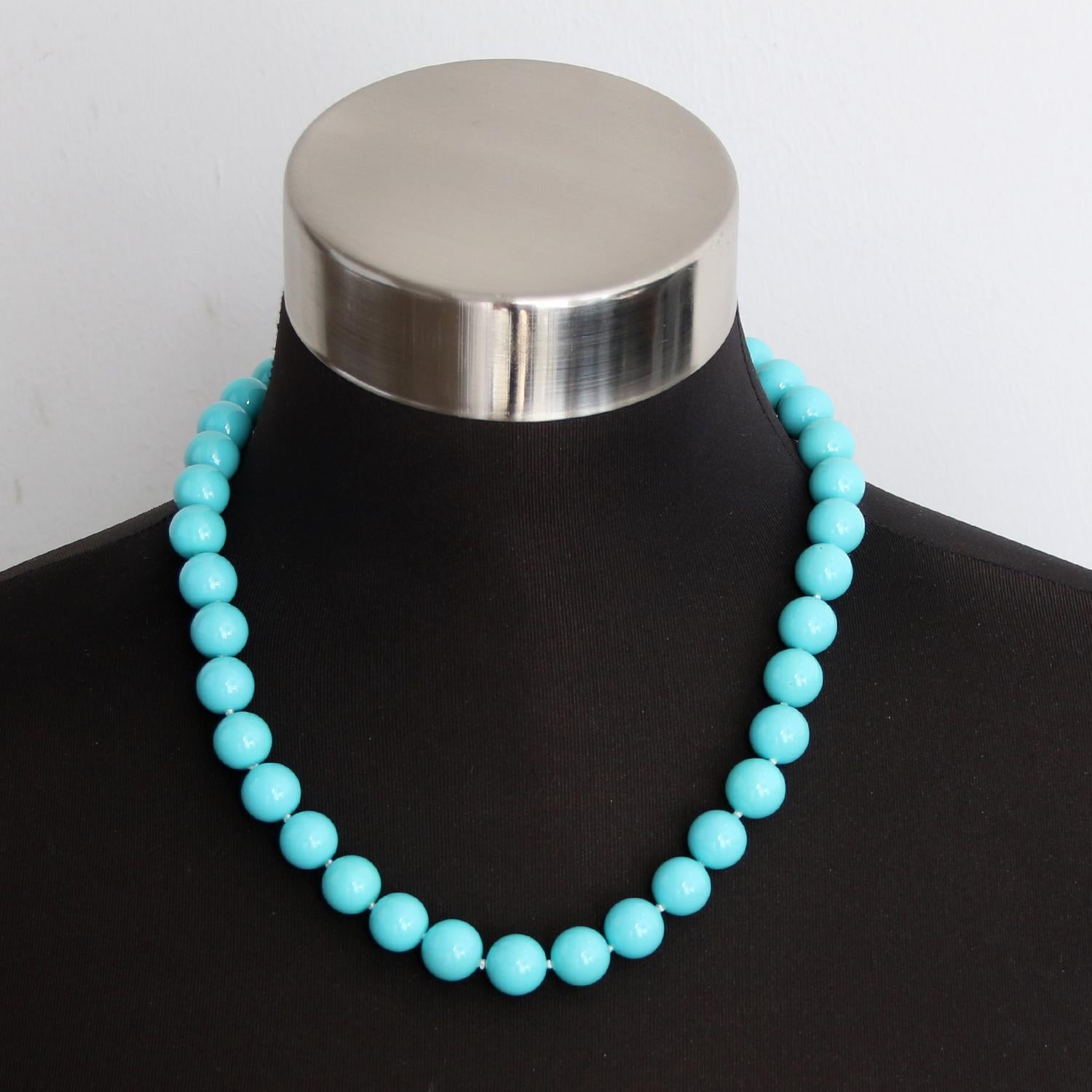 Turquoise Color Bead Necklace - A strand of forty beads in a turquoise green bluish color. Averaging  12mm a bead. Total length 20inches long with 10K yellow gold clasp .