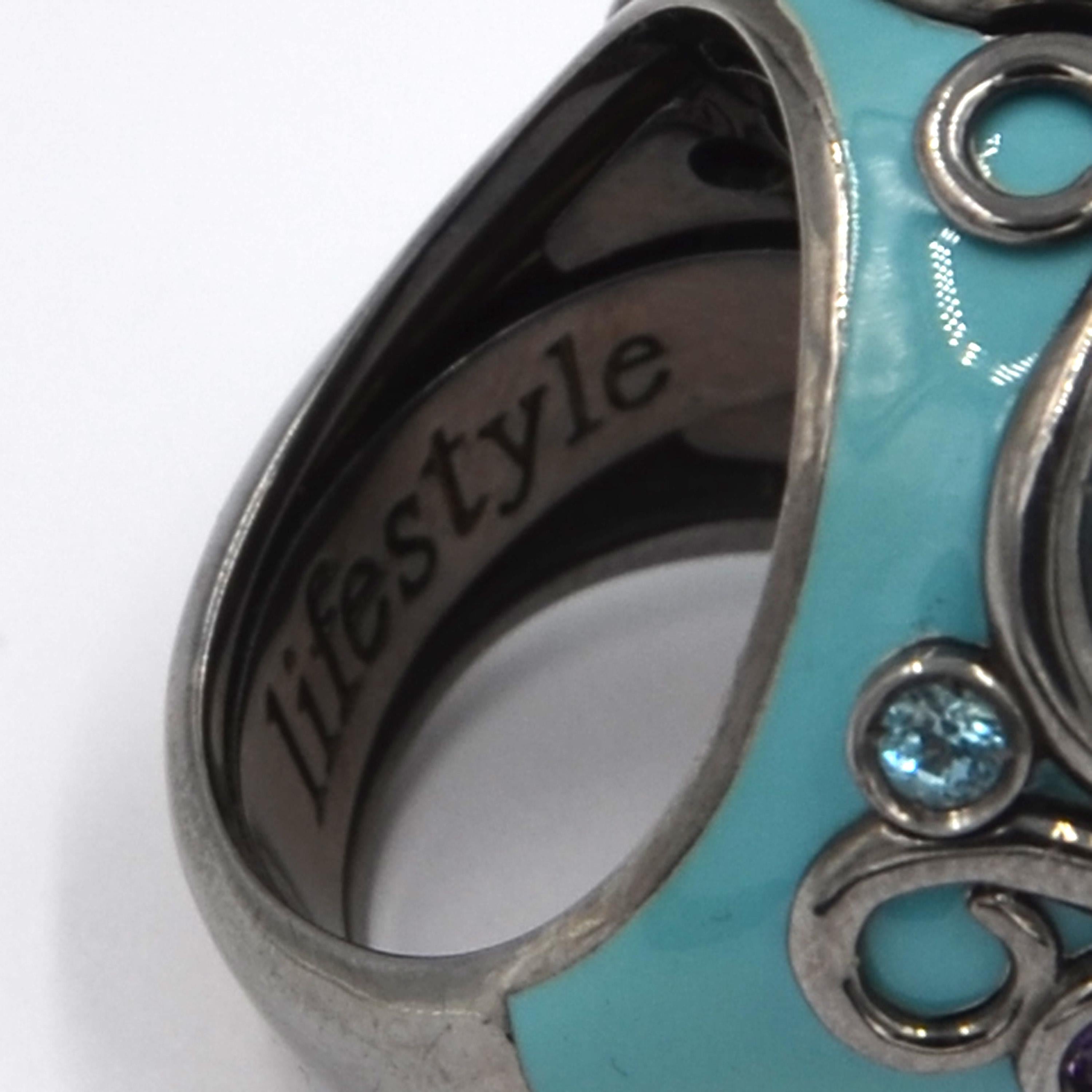 Originally designed across the millenium this fabulous turquoise color enamel ring is in silver and features a total of carat 1.39 of amethyst and blue topaz.  Handcrafted in Italy, from the Garavelli Lifestyle collection. 
Indulge in the timeless