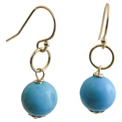 Orecchini a goccia con Howlite color turchese riempiti d'oro
