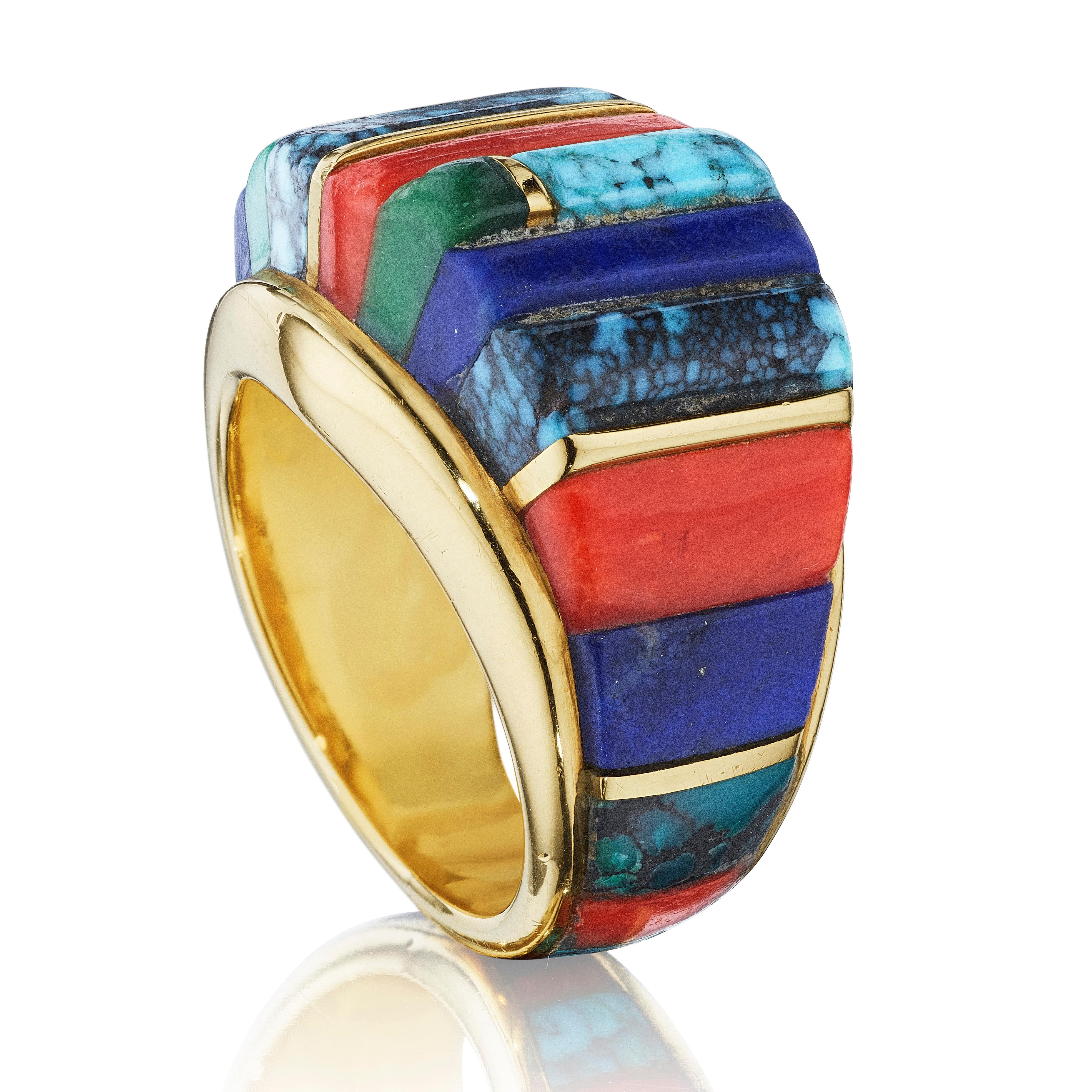 A ring of stacked turquoise, coral, lapis lazuli, malachite, and gold; mounted in 18-karat gold
• Signed Loloma
• Ring Size: 5½

Charles Loloma is the finest Native American jeweler of the twentieth century. In the 1960s and 1970s, he created
