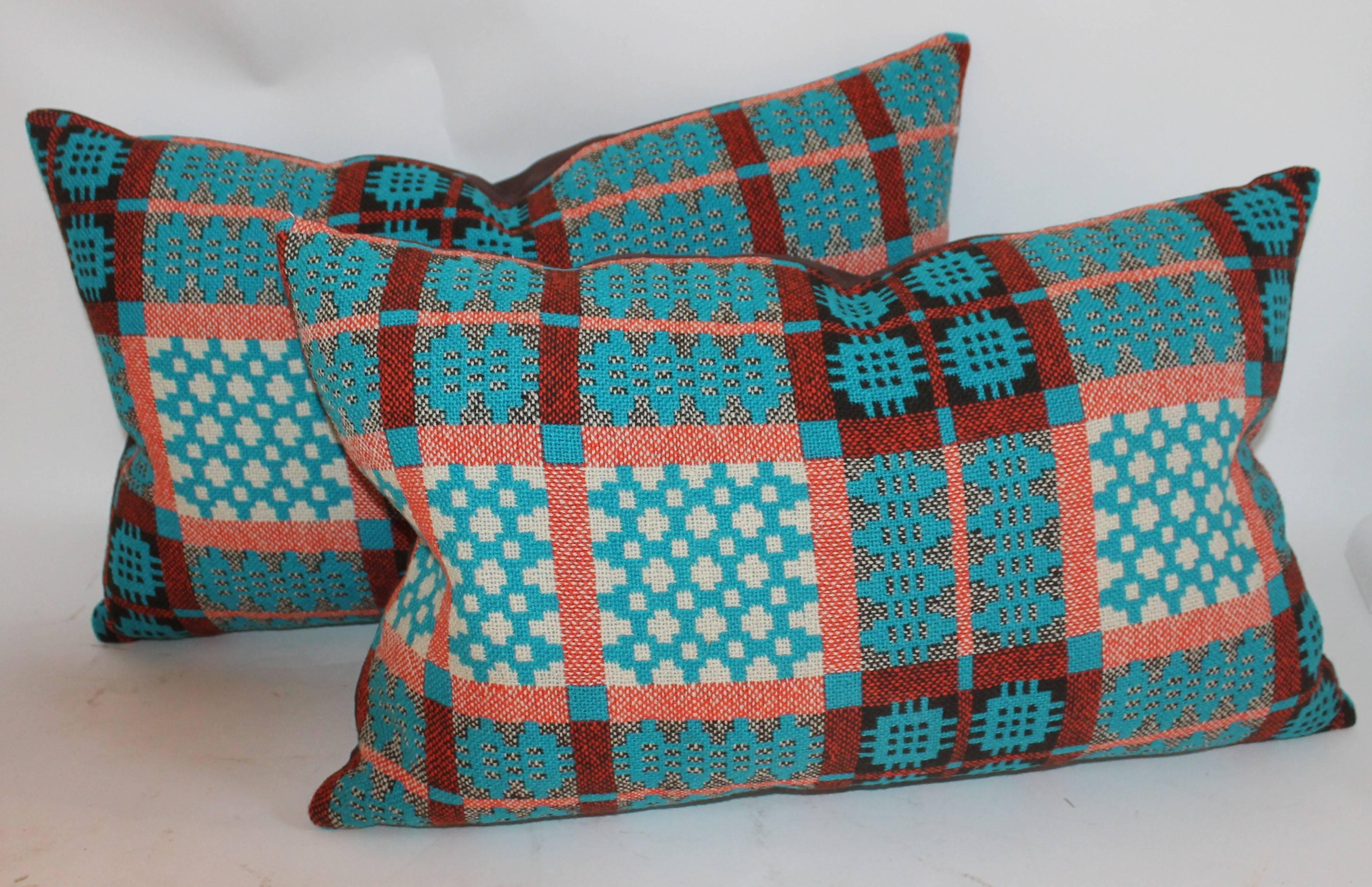 Turquoise 19th century Welsh woven coverlet pillows newly made. The condition is pristine. This is the only pair of these bolster pillows. The backing is in brown cotton linen.