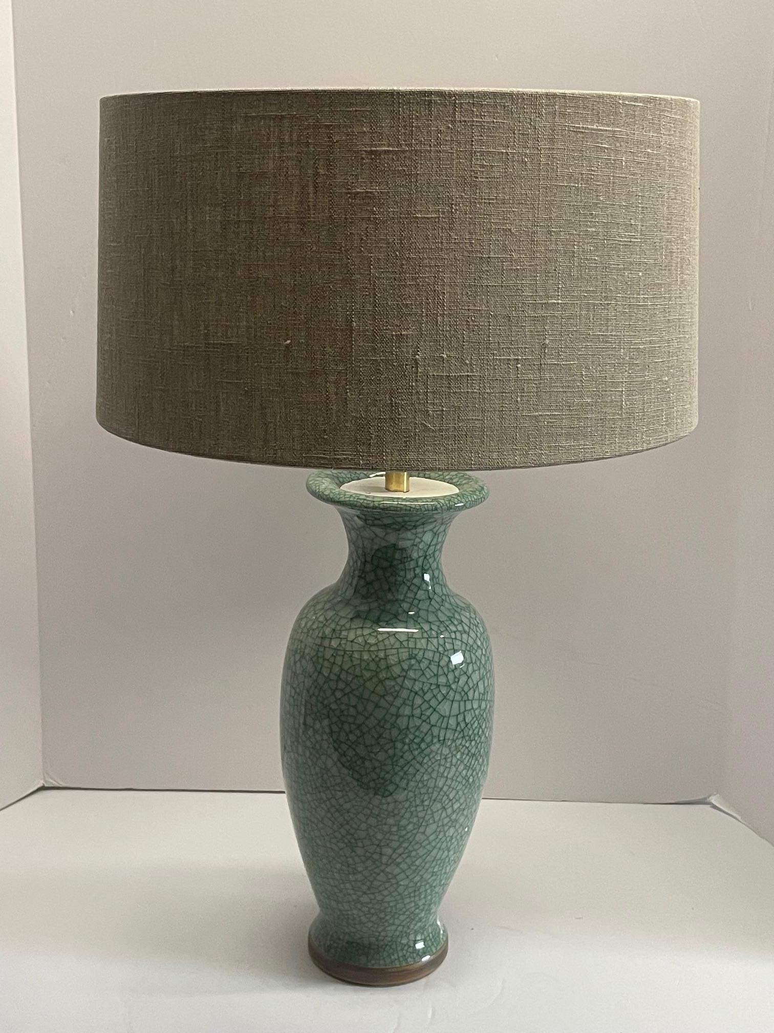 Contemporary Chinese pair classic tall cylinder tulip shaped lamps.
Crackle turquoise glaze.
Base measures 6
