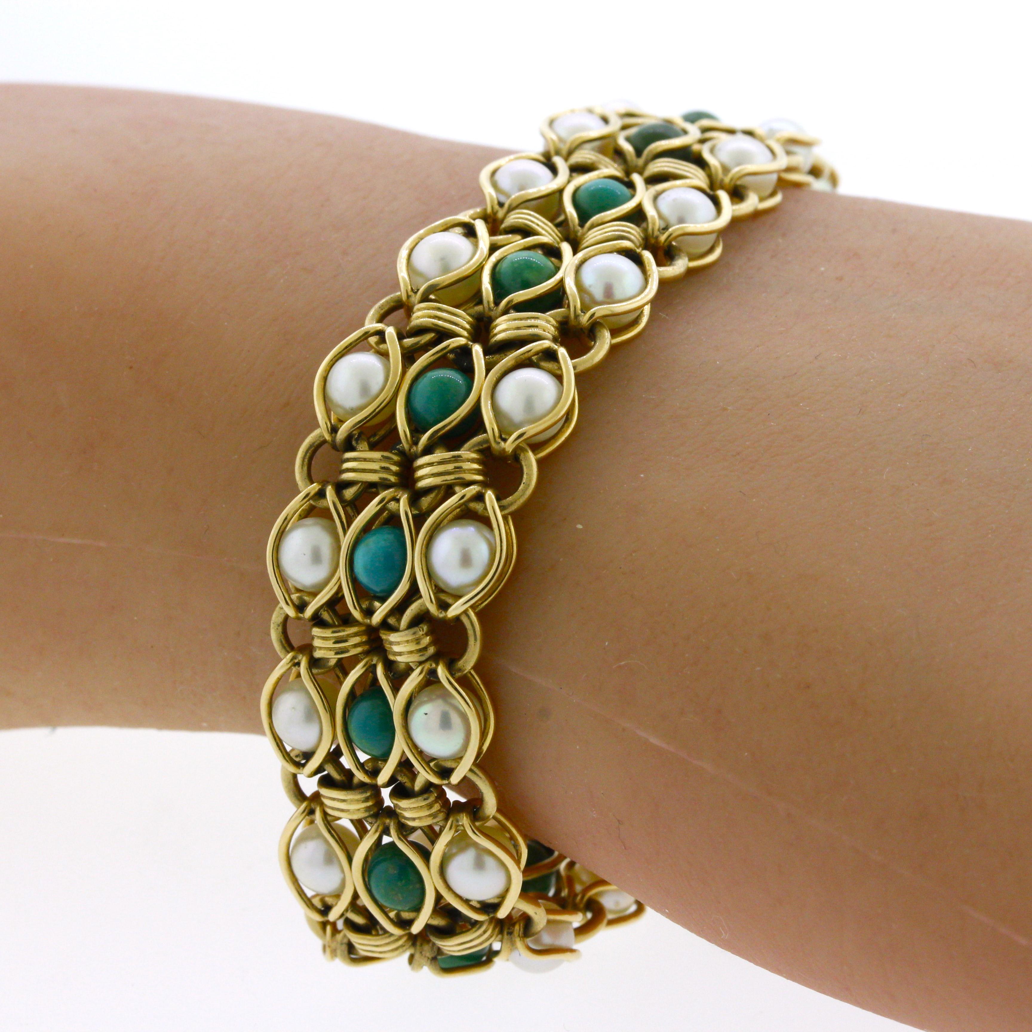 A stylish bracelet featuring turquoise and cultured pearls. The center row features 16 pieces of rounded turquoise with a bluish-green color along with two outer rows of cultured pearls. Made in 14k yellow gold and ready to be worn.

Length: 7
