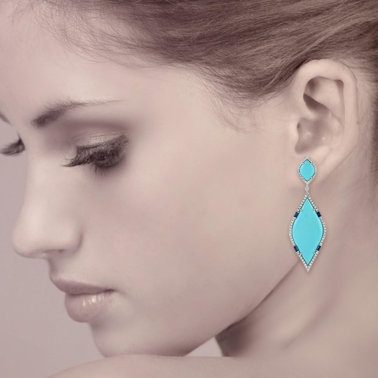 Handcrafted from 18-karat gold, these beautiful earrings are set with 22.65 carats Turquoise, .55 carats sapphire and 1.57 carats of glimmering diamonds.

FOLLOW  MEGHNA JEWELS storefront to view the latest collection & exclusive pieces.  Meghna
