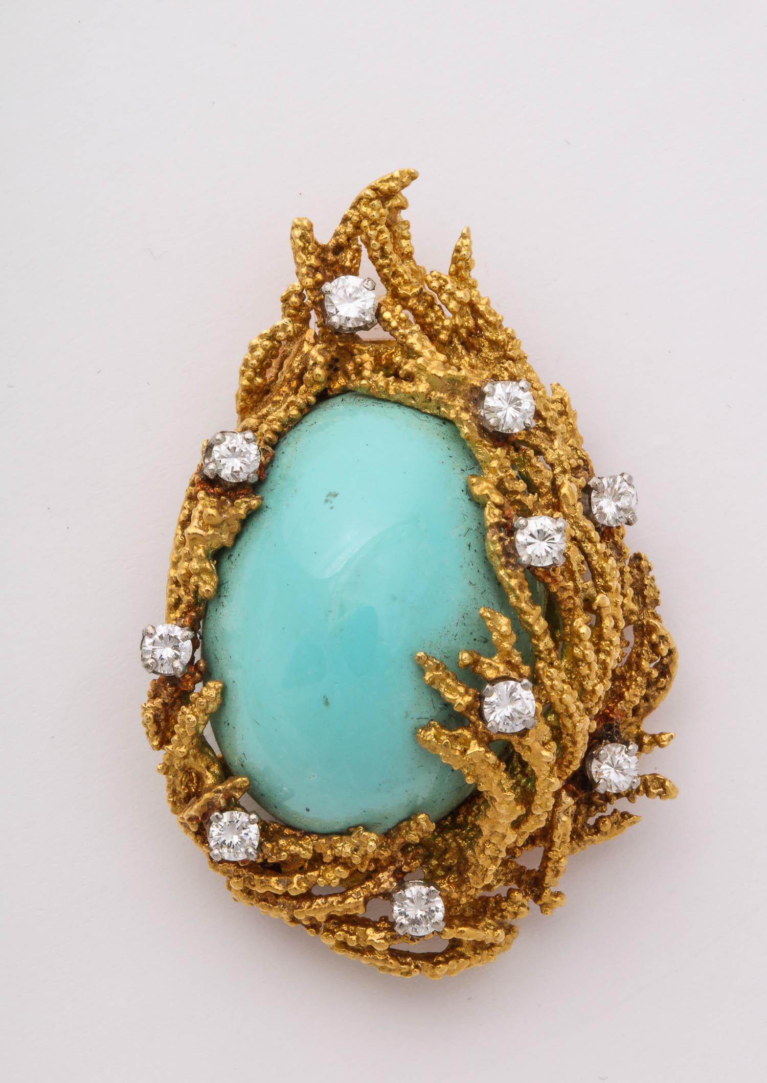 18k abstract gold brooch, centering a large cabochon Natural Turquoise (25 x 18mm)  10 diamonds 1.00 carat, 28 grams of 18k yellow gold 