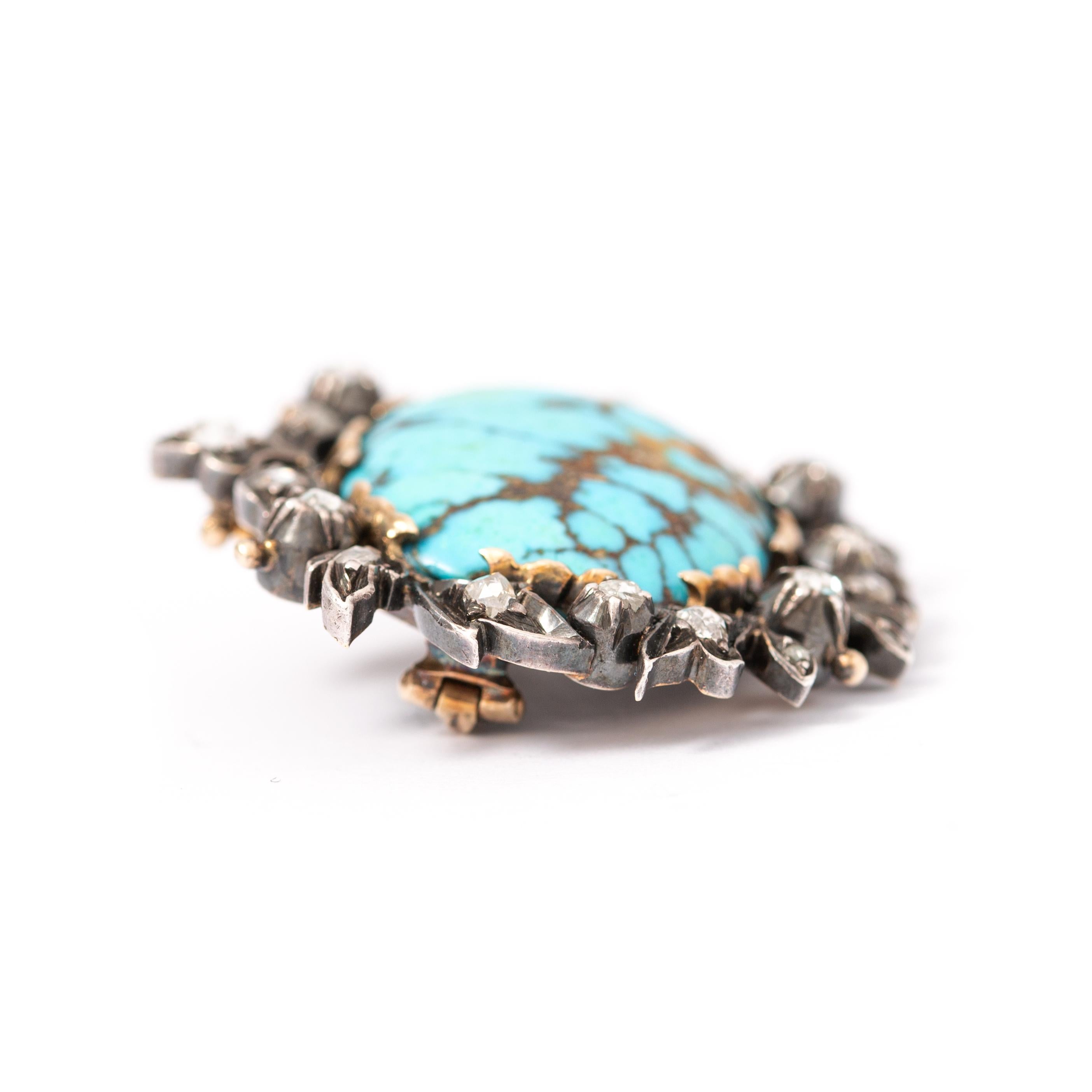 Antique 14K gold and 800 silver brooch centered by a turquoise matrix surrounded by rose cut diamonds. 
Early 20th century. 
Size of the turquoise: 2.30 x 1.70 cm. 
Gross weight: 11.40 grams.