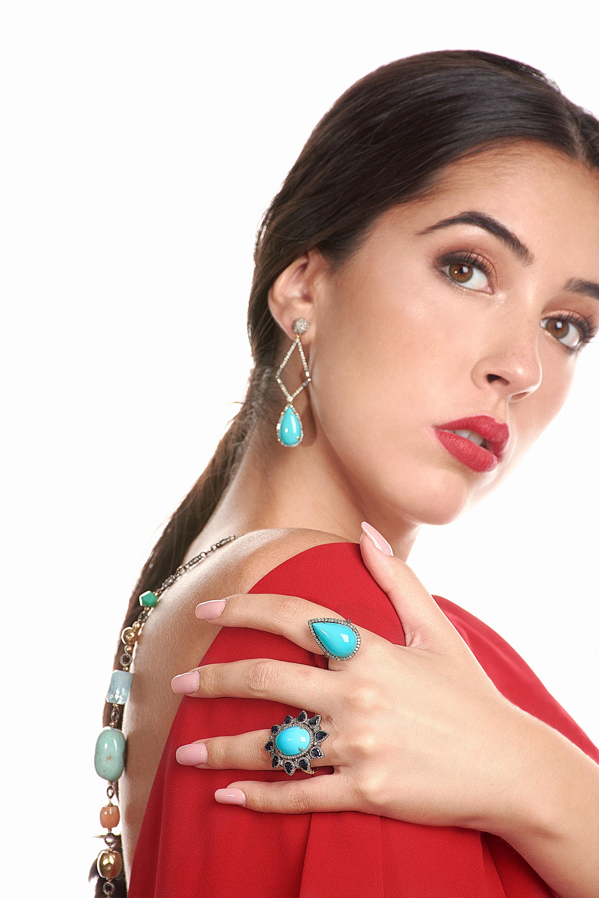 These beautiful earrings are meticulously crafted in 14-karat gold and sterling silver. It is set in 10.67 carats Turquoise and 2.25 carats of diamonds. 

FOLLOW  MEGHNA JEWELS storefront to view the latest collection & exclusive pieces.  Meghna