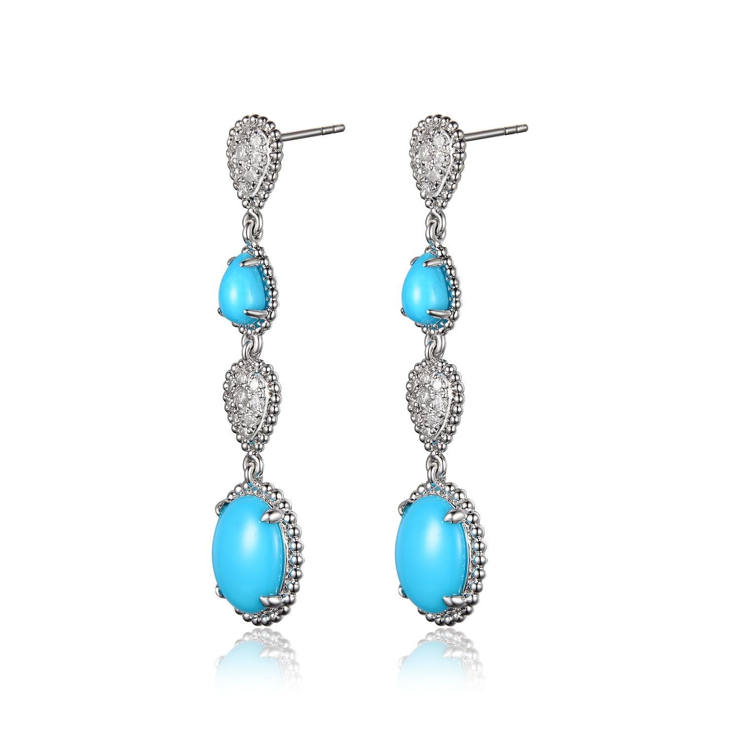 This earrings feature 3.95 carats of sleeping beauty turquoise. Assented 0.37 carat of white round diamonds. Earrings are set in 18 karat white gold. 

