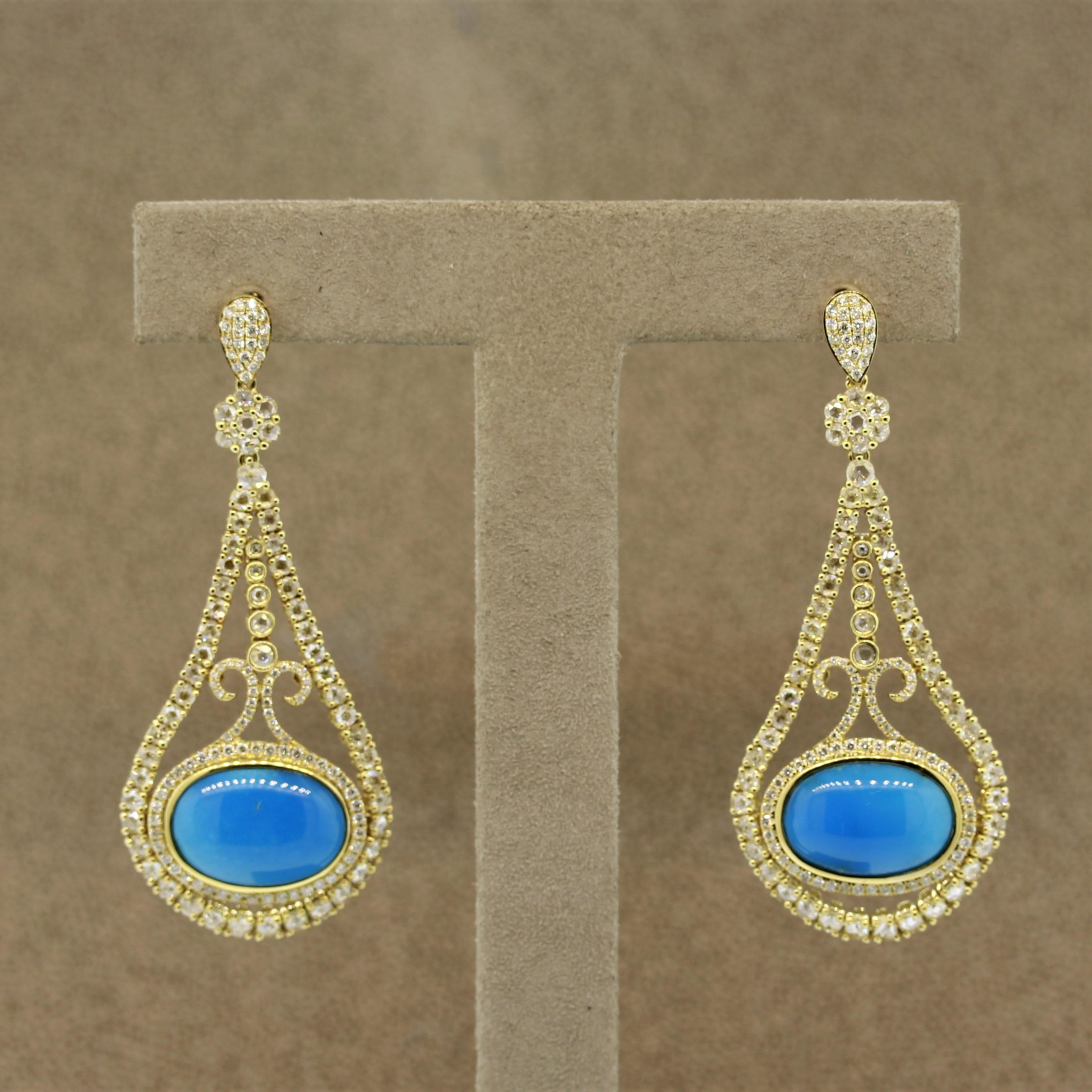 A lovely pair of diamond earrings featuring 2 pieces of turquoise with a beautiful even blue color which weigh a total of 14.40 carats. They are completed by 3.49 carats of diamonds which are both rose cuts and round brilliants. Hand fabricated in