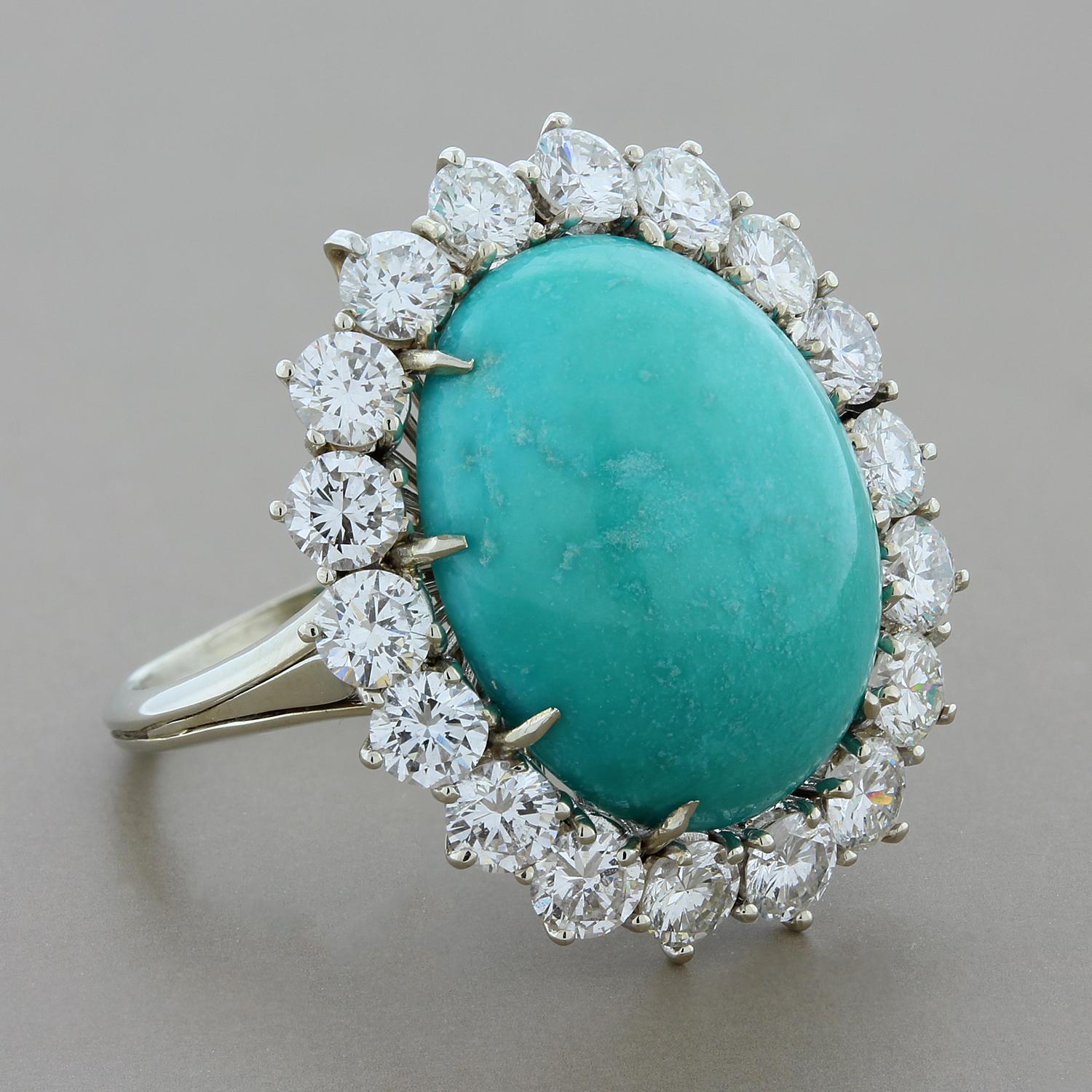 An exceptional ring featuring a beautifully colored slightly greenish blue turquoise of gem quality. Haloing the prized gemstone are 3.03 carats of round cut white VS diamonds set in 14K white gold.

Ring Size 6.75 (Sizable)
