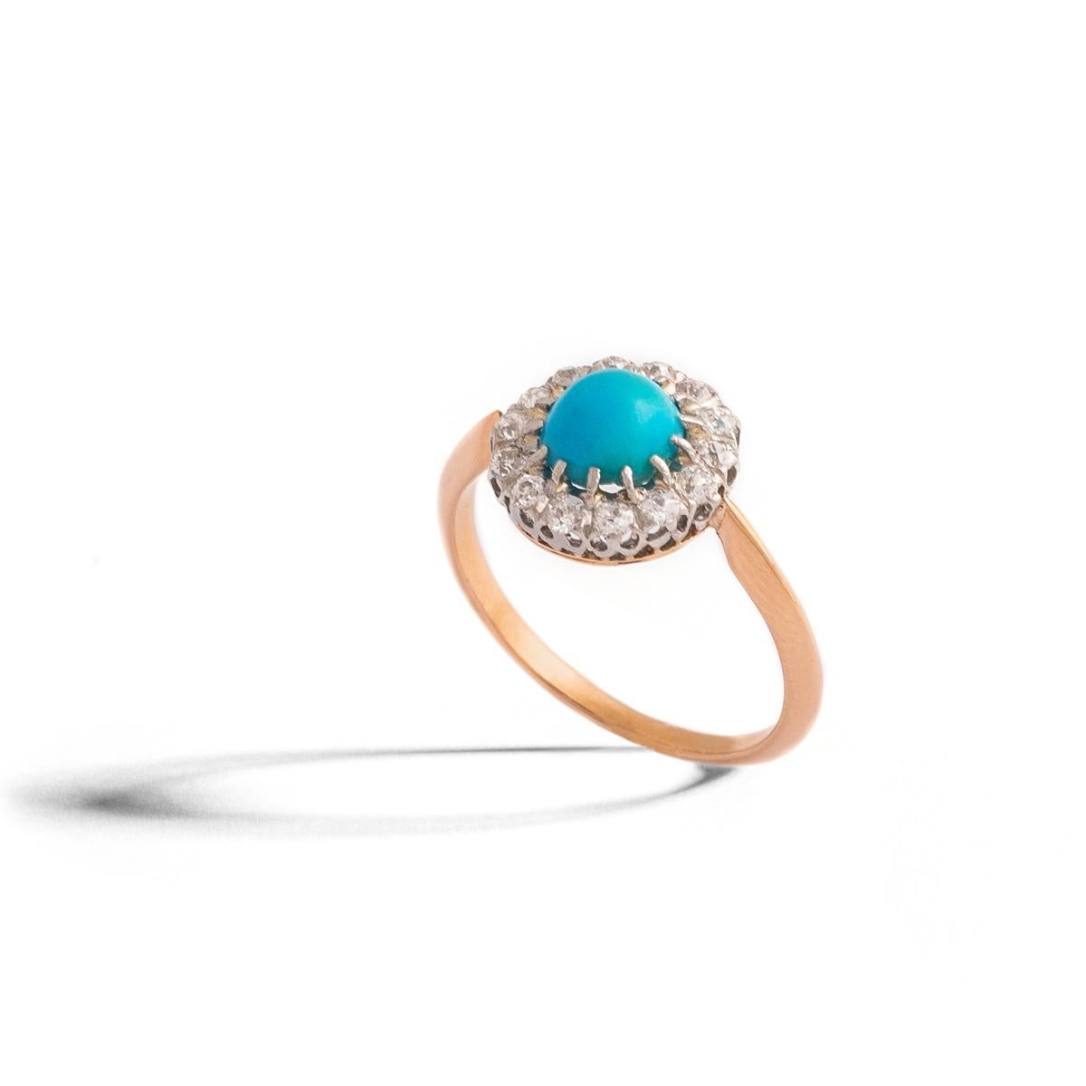 Turquoise cabochon and round cut Diamonds cluster yellow gold 18K and platinum Ring.
Turquoise diameter: 7.06 millimeters.
Diamond estimated weight: 0.25 carat.
Ring Size: 6 1/2.
Gross weight: 3.42 grams

