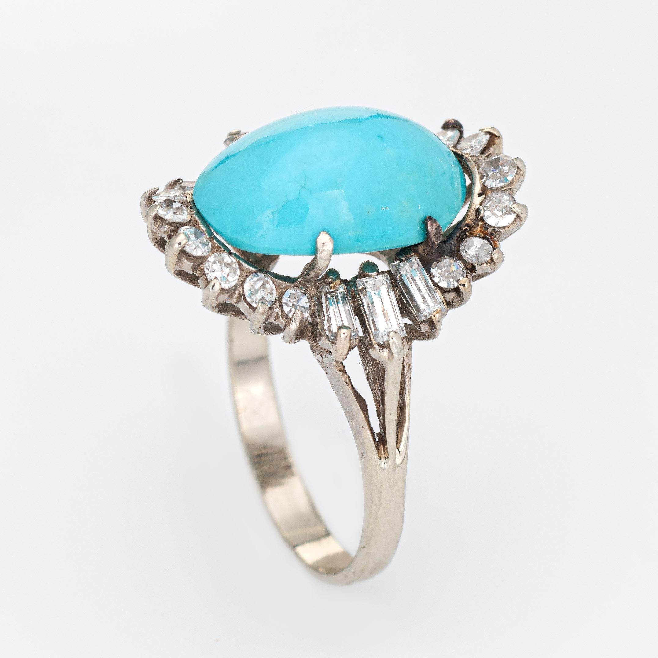 Stylish vintage turquoise & diamond ring (circa 1950s to 1960s) crafted in 14 karat white gold. 

Cabochon cut oval shaped turquoise measures 13mm x 9mm (estimated at 6.50 carats). Baguette & single cut diamonds range in size from 0.02 to 008