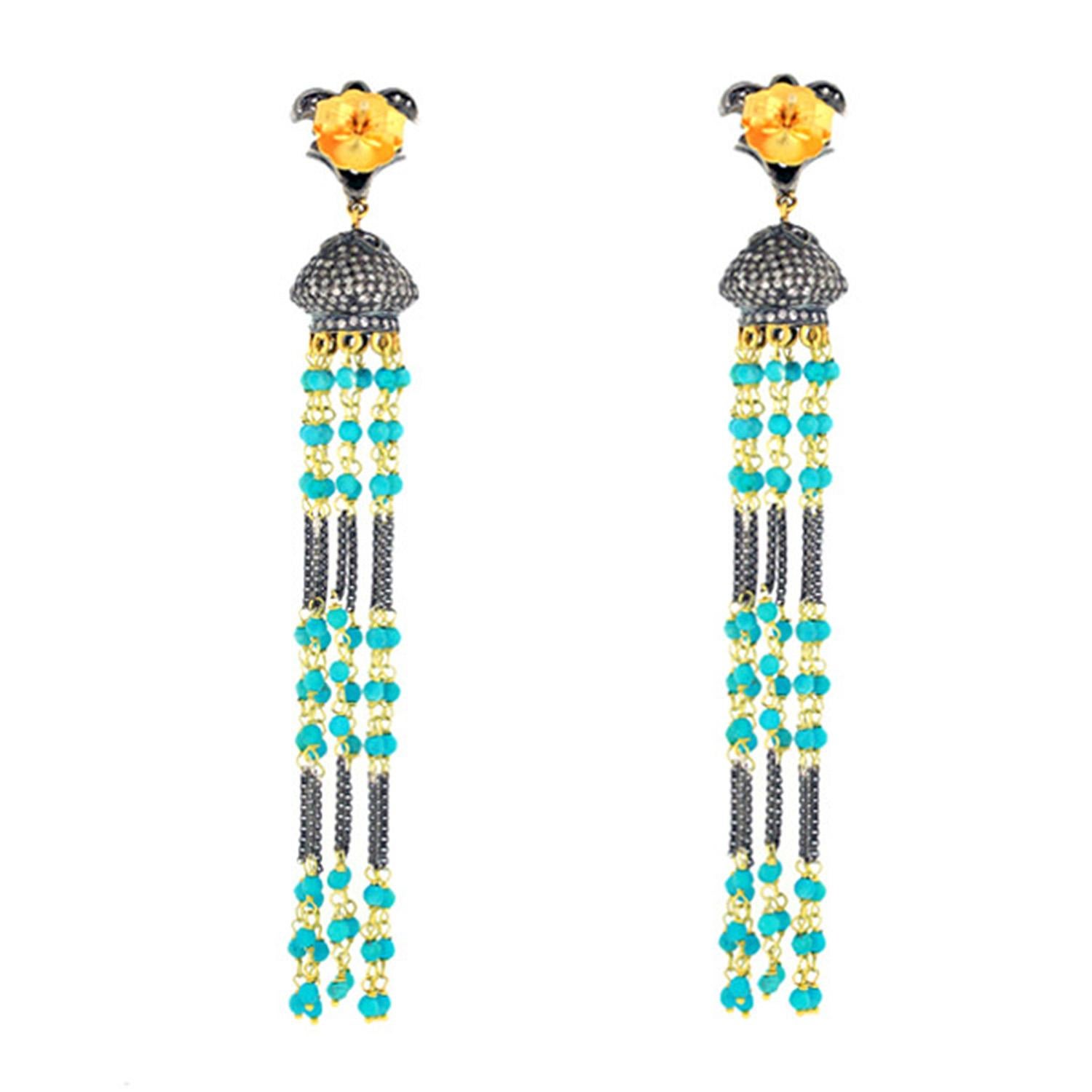 These tassel earrings are handmade in 18-karat gold & sterling silver. It is set in 9.68 carats turquoise and 2.52 carats of diamonds in blackened finish. 

FOLLOW  MEGHNA JEWELS storefront to view the latest collection & exclusive pieces.  Meghna