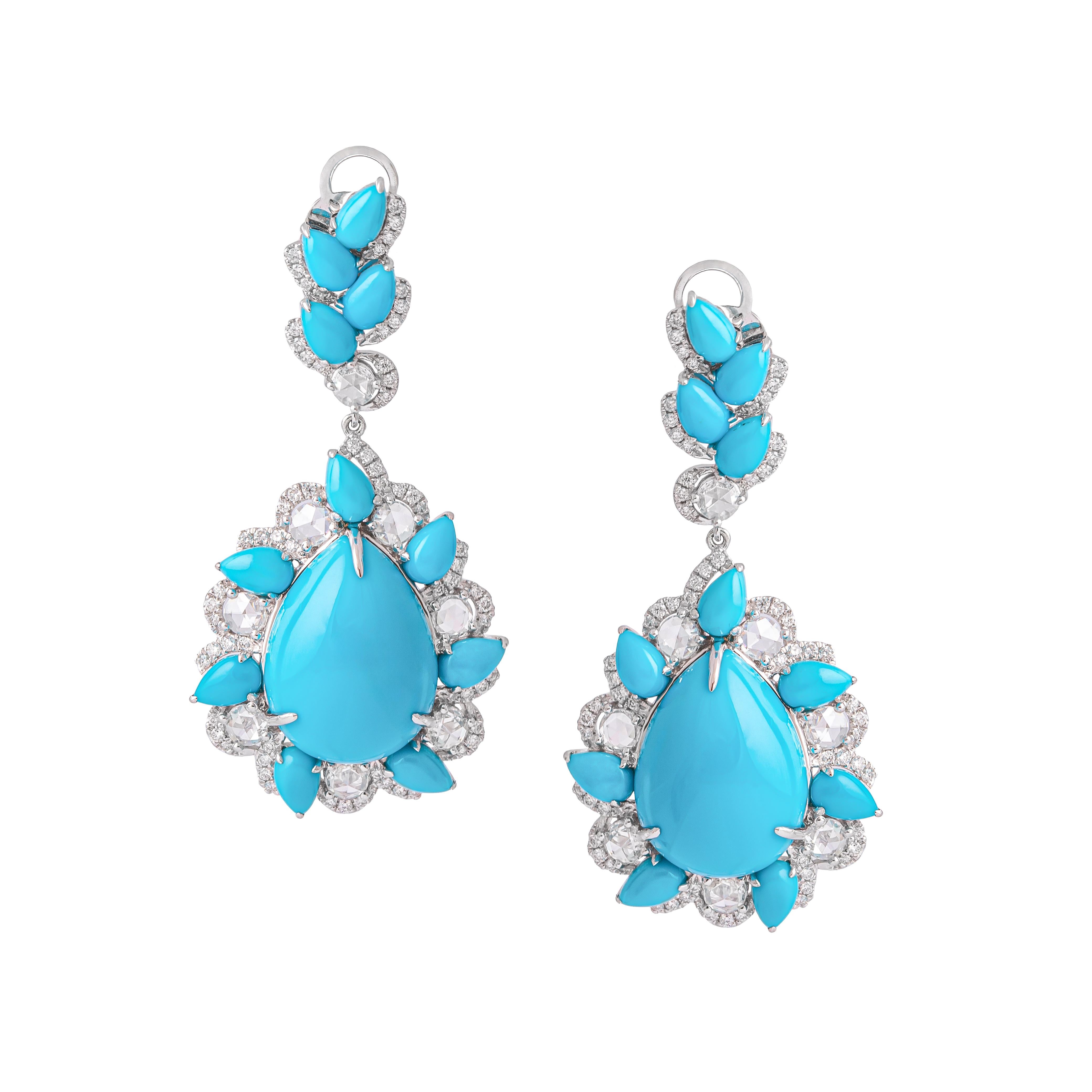 Pendant Earrings in white gold 18K rose cut 1.06 carat and round diamond 0.53 carat surrounding Turquoise cabochon pear shapes, total 17.94 carat.
Total weight: 14.84 grams.

Total length: 4.00 centimeters.