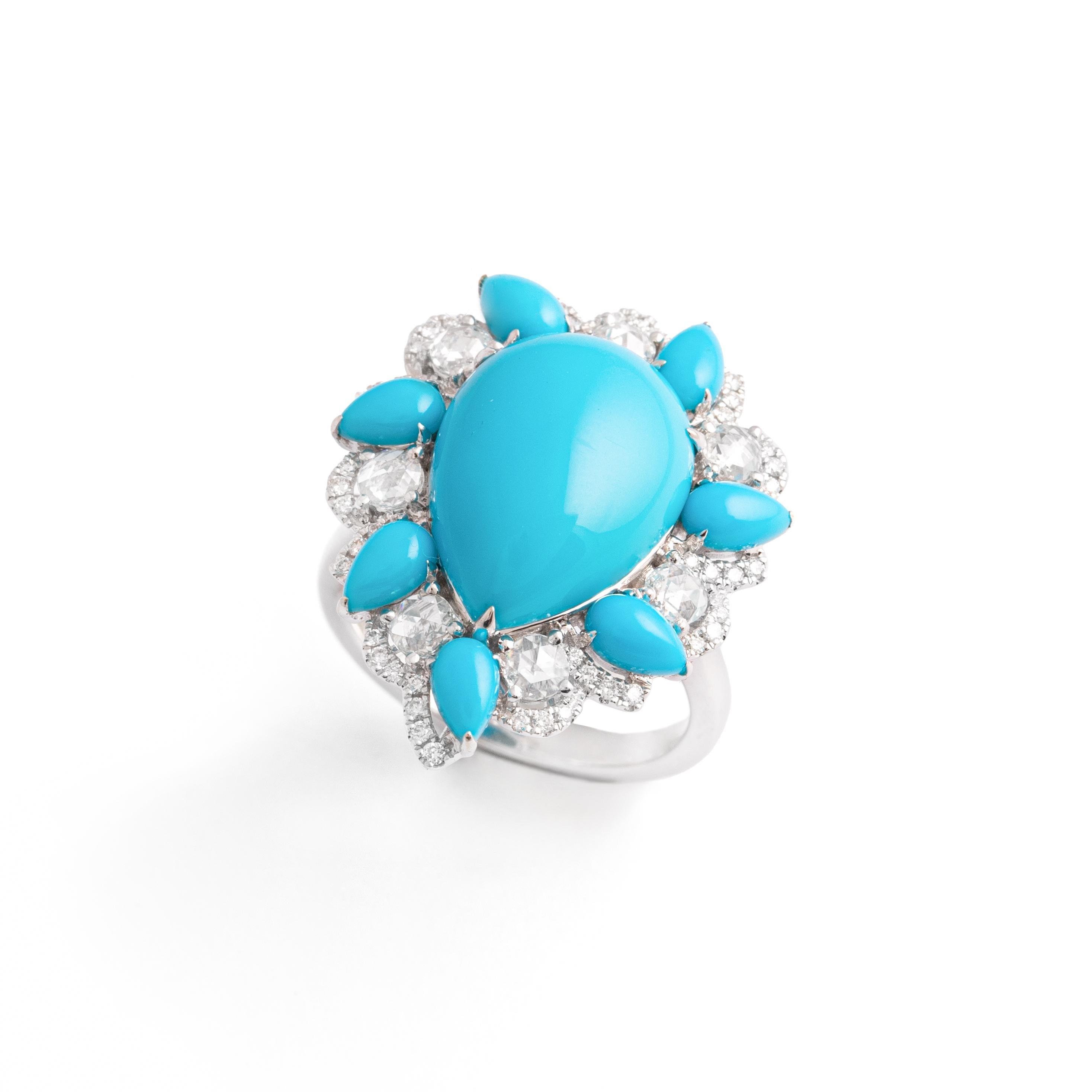 5.69 carat Turquoise cabochon pear shape surrounded by marquise shape Turquoise and Rose cut 0.46 carat and Round cut 0.18 carat Diamonds on white gold 18K.
Ring size 6.75.
Dimensions of the main motif: 2.70 x 2.20 centimeters.
Total weight: 8.83