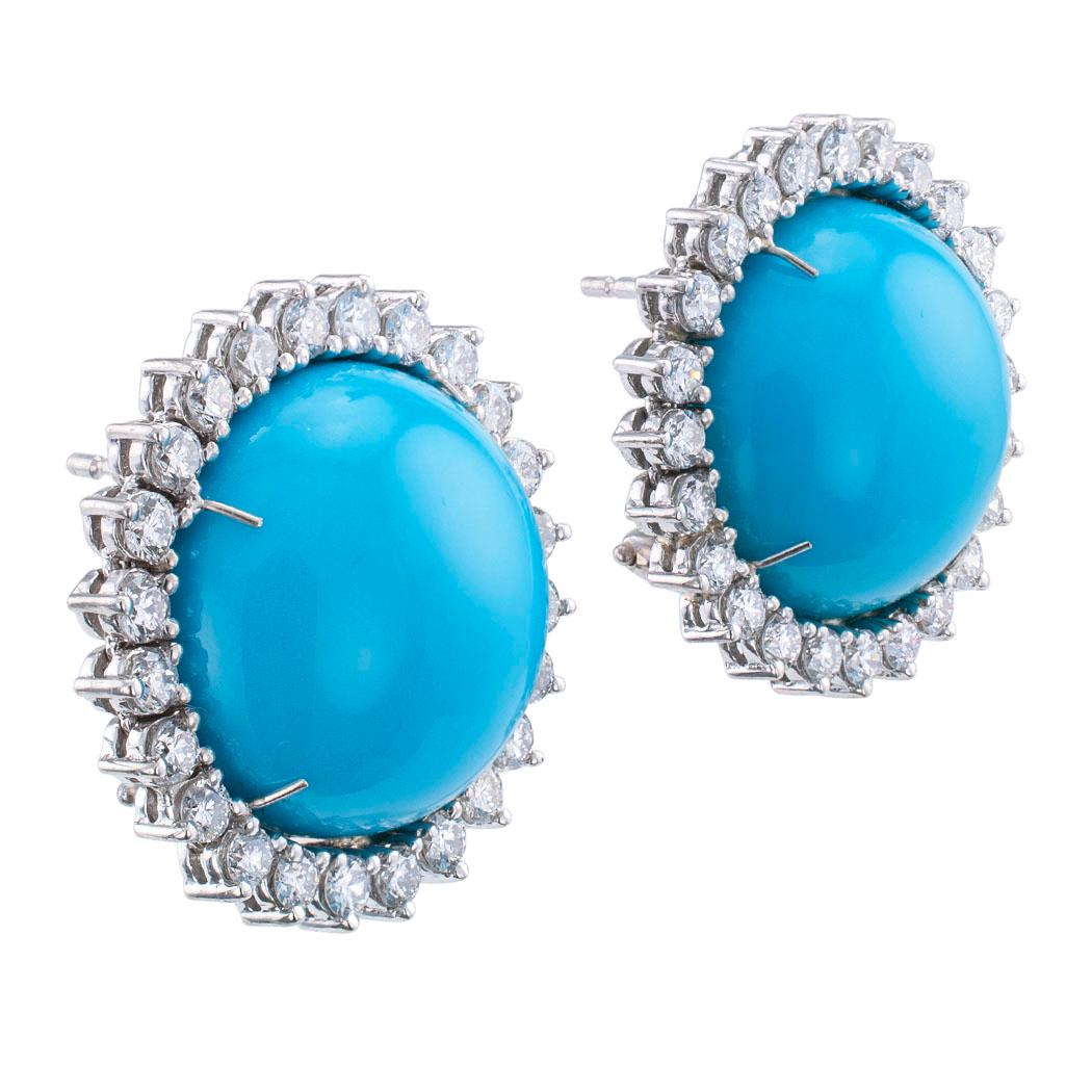 Turquoise diamond platinum and white gold earrings circa 1990.

DETAILS:
Natural cabochon turquoise diamond platinum and white gold earrings, omega clips with post backs.
DIAMONDS: forty-eight round brilliant-cut diamonds totaling approximately 1.90