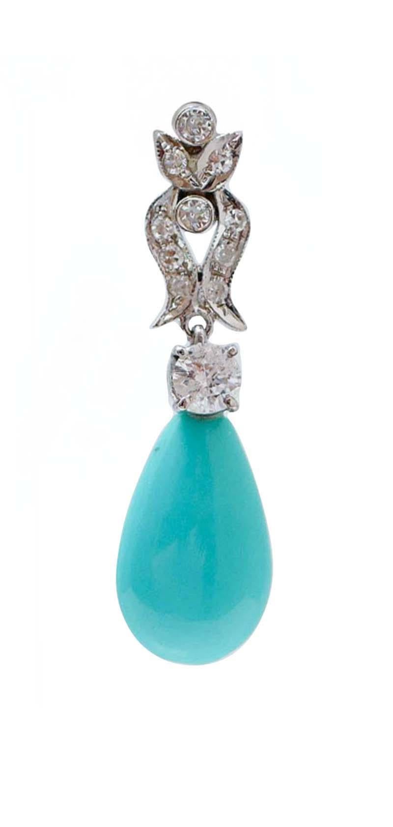 Splendidi orecchini con struttura in oro bianco 14 kt montati con diamanti nella parte superiore e un turchese a goccia come pendente.
Questi orecchini sono stati realizzati a mano da maestri orafi italiani.  e sono in perfette condizioni.
Diamanti