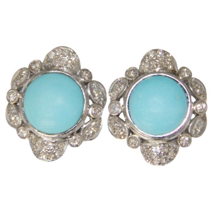 Enhance your collection with these Art Nouveau-inspired earrings, a stunning example of timeless elegance and design. Crafted in 18kt white gold, these earrings perfectly blend the fluidity of natural forms with the brilliance of precious stones,