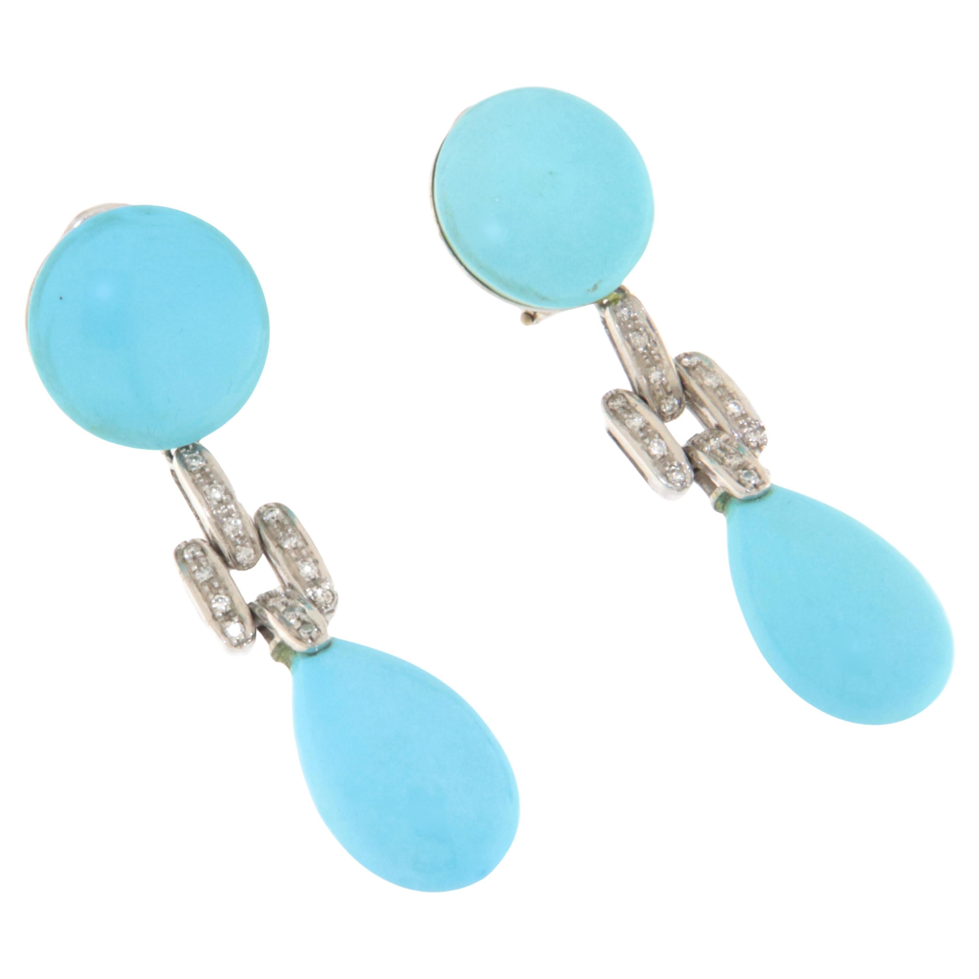 Refined 18-karat white gold dangling earrings, adorned with brilliant-cut diamonds and exceptional quality natural turquoise stones from Arizona. These earrings embody a perfect blend of luxury and elegance, designed for those who wish to wear a
