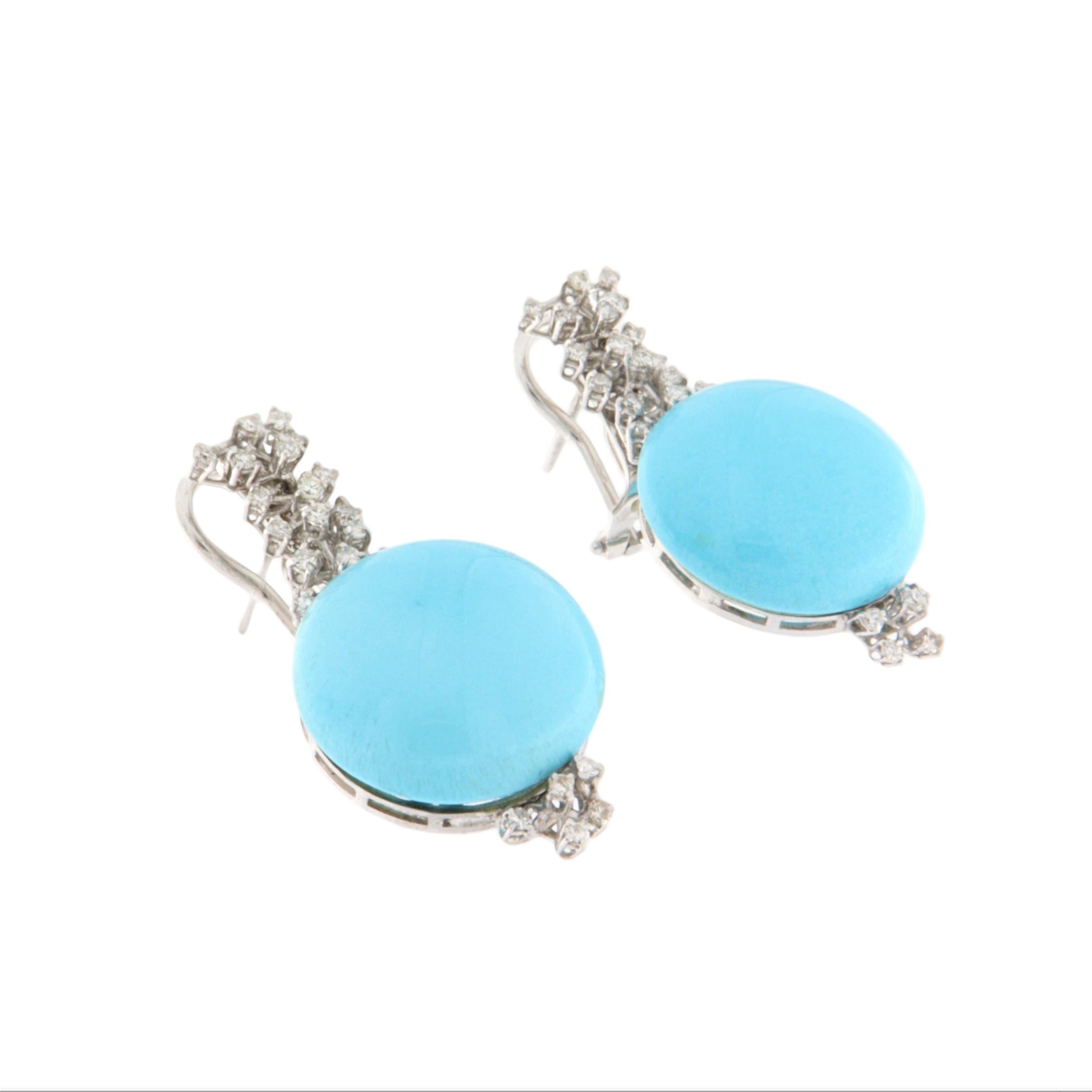 Elegant and refined, these 18-karat white gold earrings are a perfect blend of classic design and high-quality materials. The centerpiece is a pair of natural turquoise stones sourced from Arizona—one of the most renowned origins in the world for