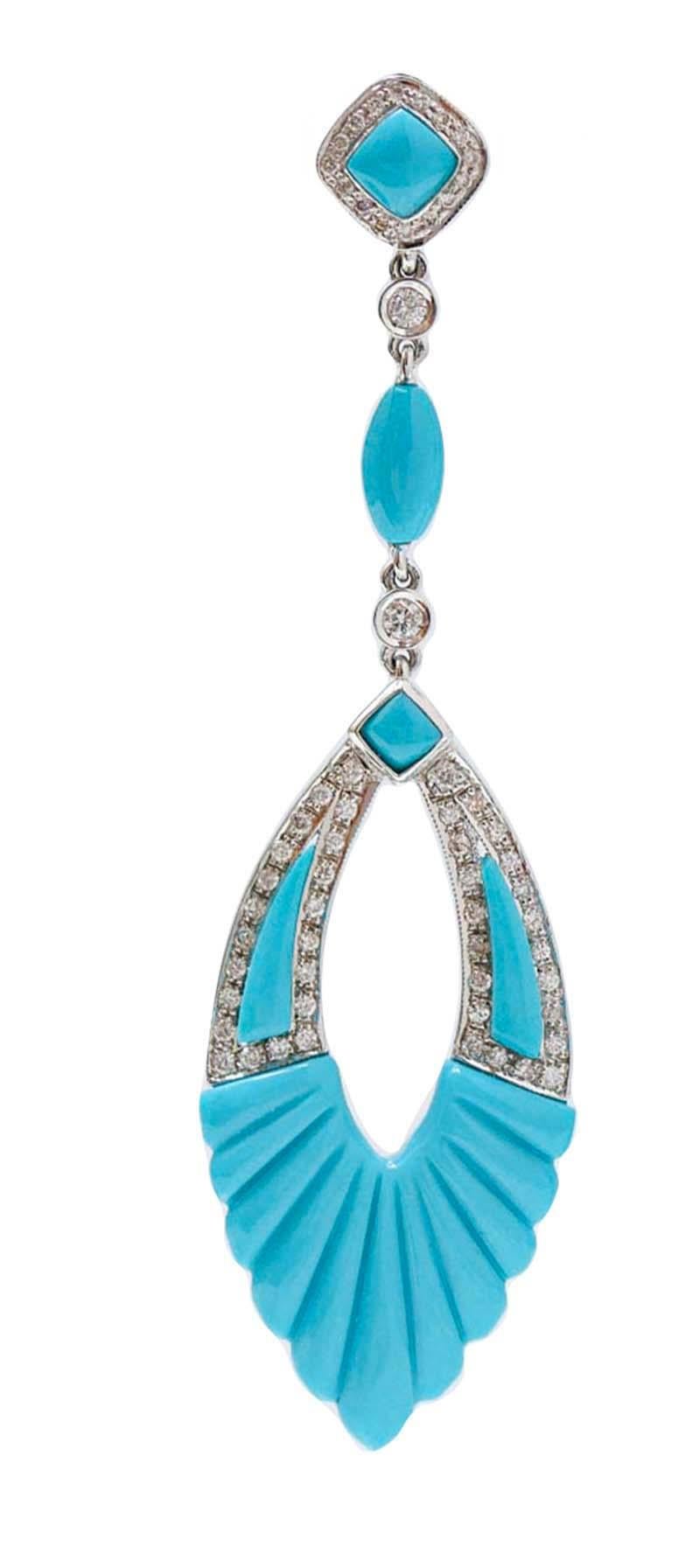 Amazing earrings in 18 kt white gold structure mounted with diamonds and turquoise for all the length.
These earrings were totally handmade by Italian master goldsmiths and they are in perfect conditions.
Diamonds 0.84 ct
Turquoise 2.70 gr
Total