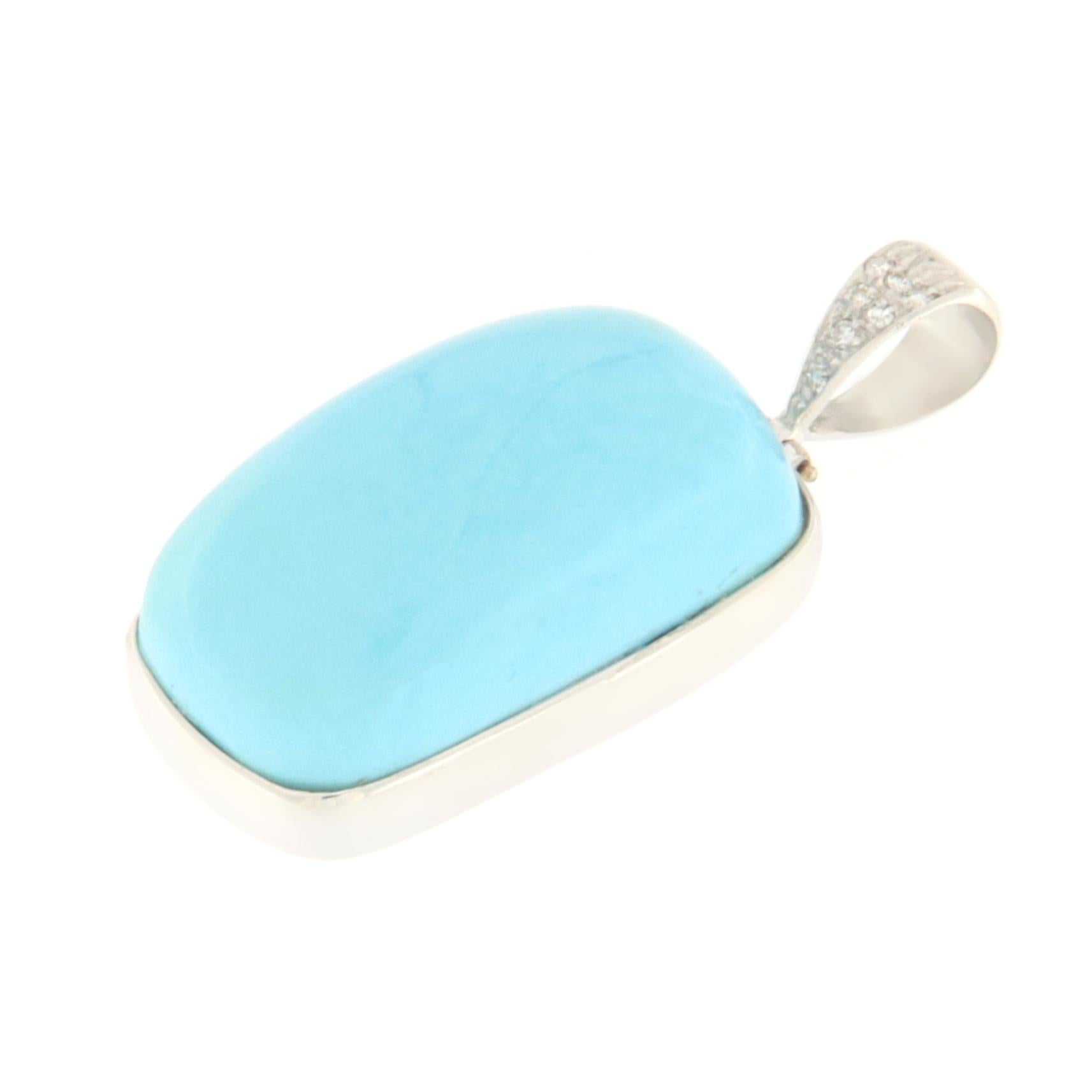 This pendant, crafted in fine 18-karat white gold, is a true statement of style and sophistication. At the heart of this exquisite creation lies a natural turquoise, selected for its vibrant blue hue that captures the essence of the sky and sea.