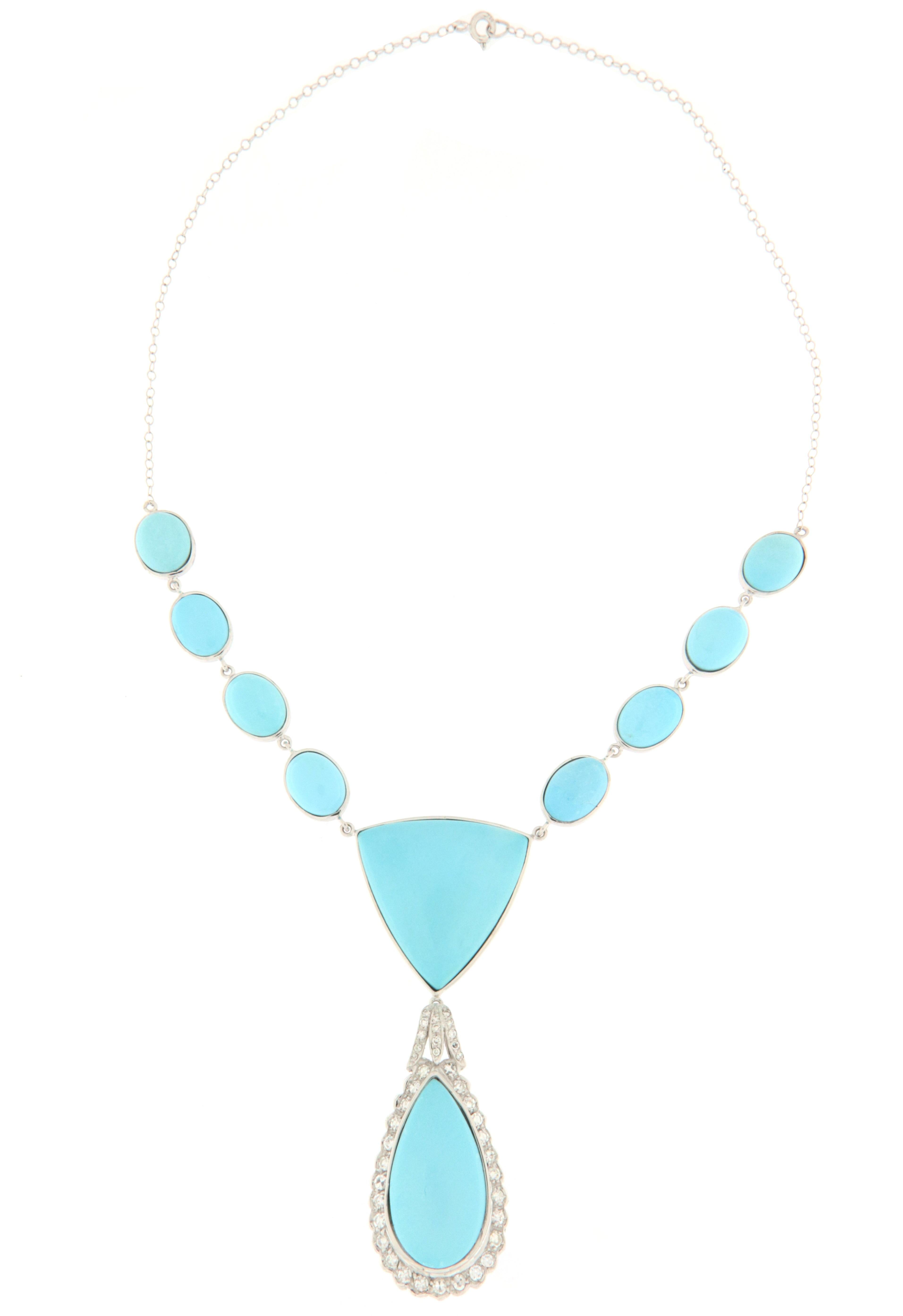 This necklace in 18-karat white gold is a masterpiece of rare beauty, embodying elegance and sophisticated charm. At the heart of this unique piece of jewelry, a drop of turquoise, with its deep blue color reminiscent of tropical seas, is