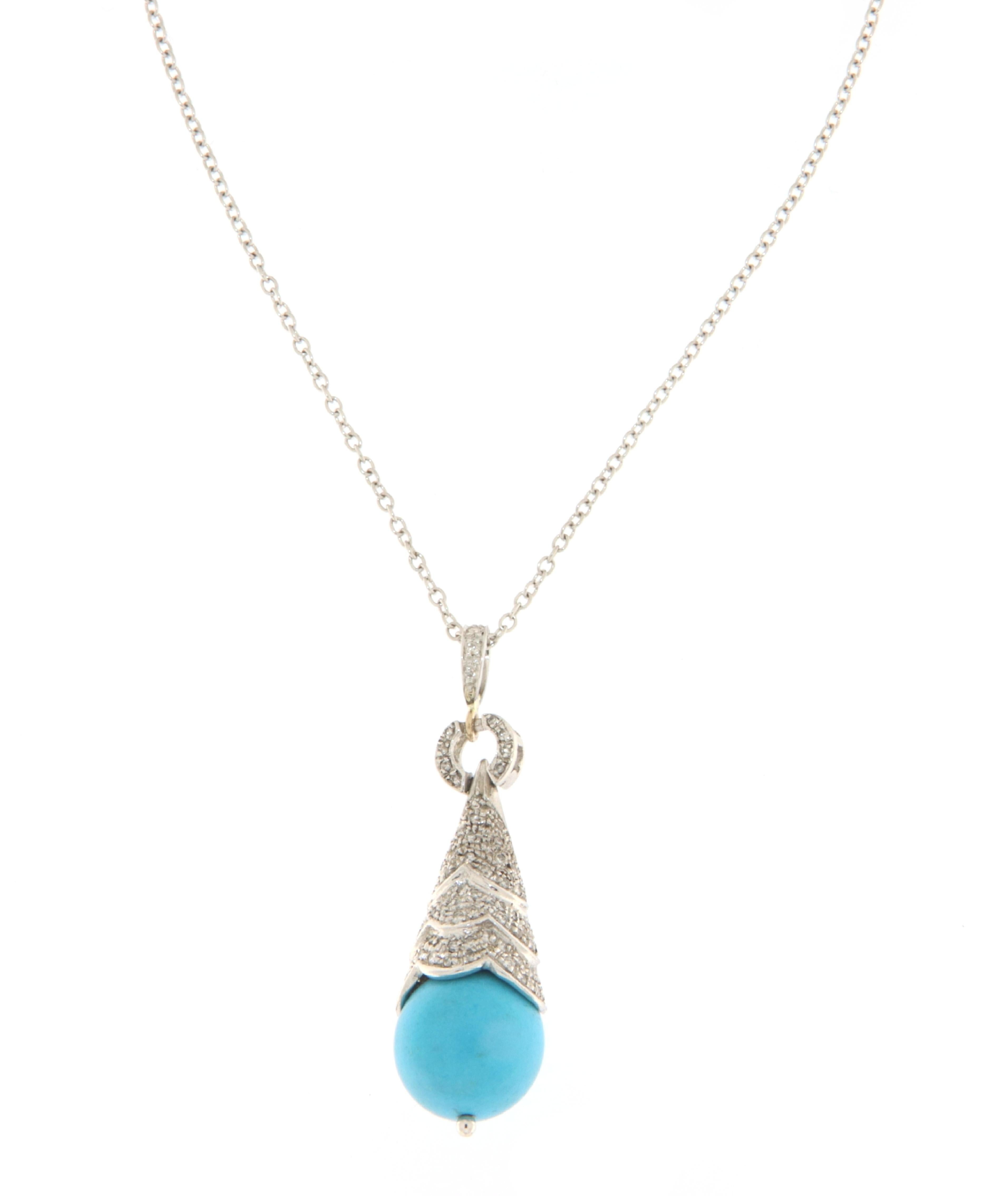 This elegant necklace is a statement piece fashioned from 18-karat white gold, featuring a pendant with a vibrant turquoise sphere that adds a pop of color and a touch of natural beauty. The turquoise is complemented by a generous scattering of