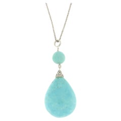 Collier pendentif en or blanc 18 carats avec turquoises et diamants