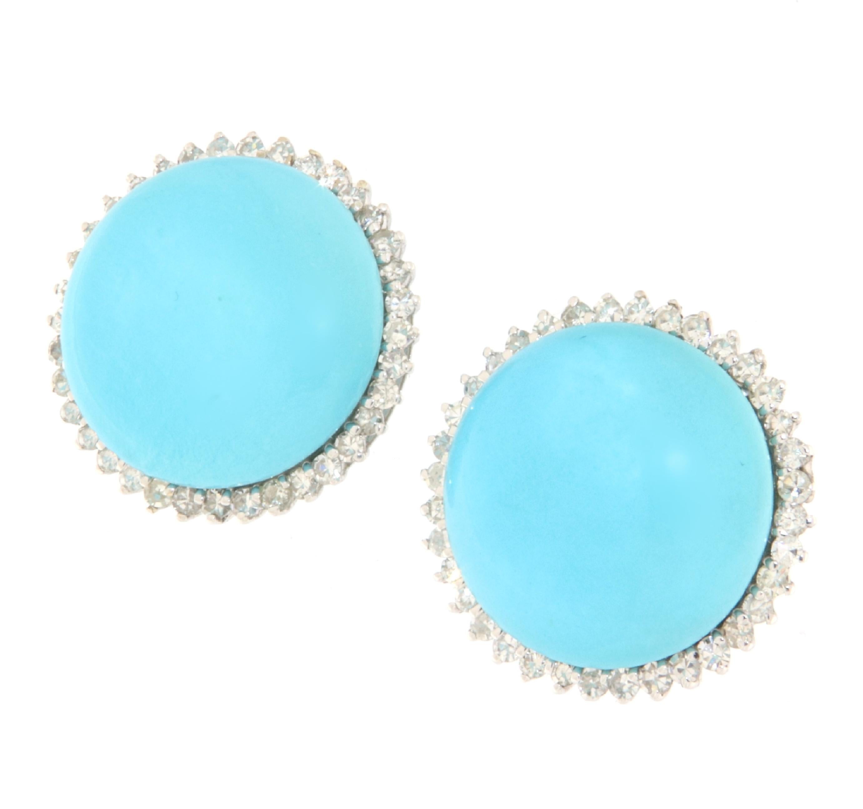 These stunning earrings in 18-karat white gold are a true tribute to elegance and natural charm, embellished with natural turquoise from Arizona and surrounded by sparkling diamonds. The combination of vibrant turquoise with the enchanting sparkle