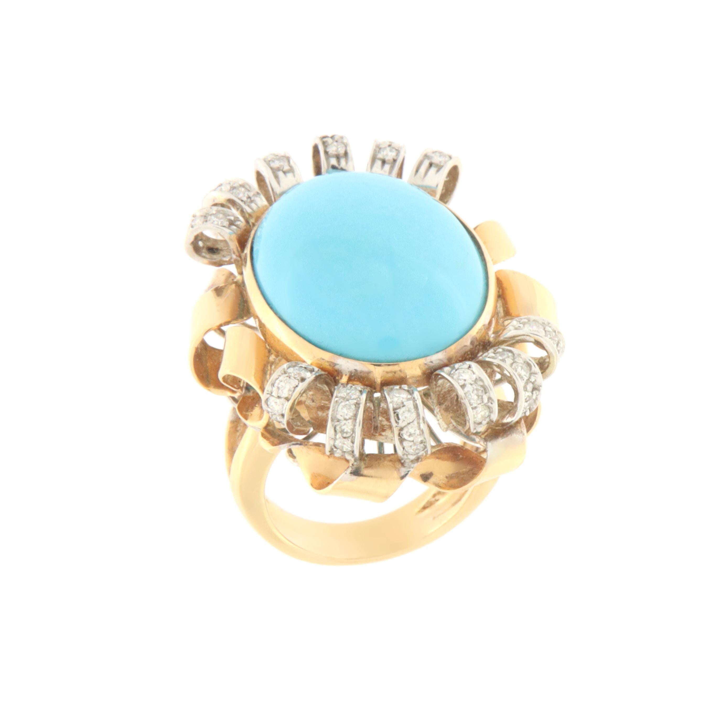 Fantastic ring made of 18 karat yellow and white gold with natural diamonds surrounding it on yellow gold and natural oval cut turquoise in the center,  entirely handmade by expert craftsmen in the sector.  The designer from the central stone alone