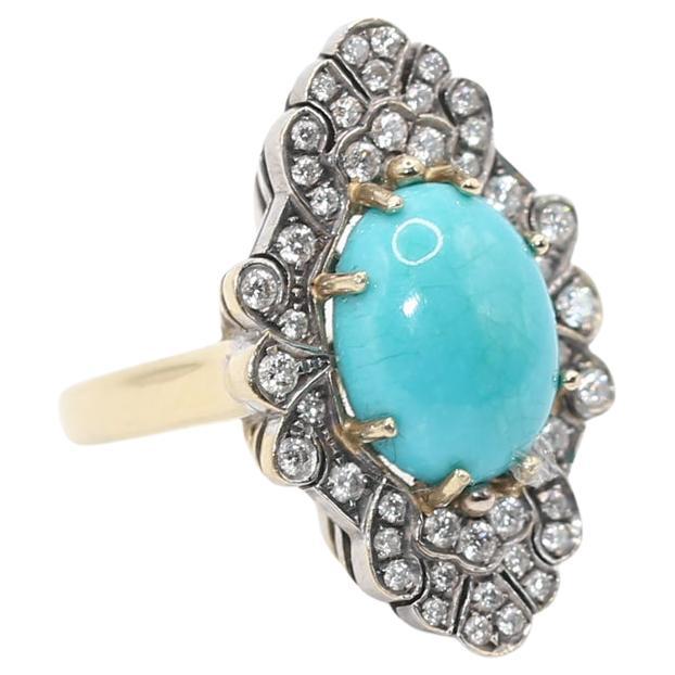 The Turquoise Diamonds Ring was created around 1970-es. A truly Disco coloured design!

Fine oval shaped bright coloured Turquoise stone is set in Yellow and White Gold, surrounded by round cut Diamonds of fine quality.
The stylish design looks